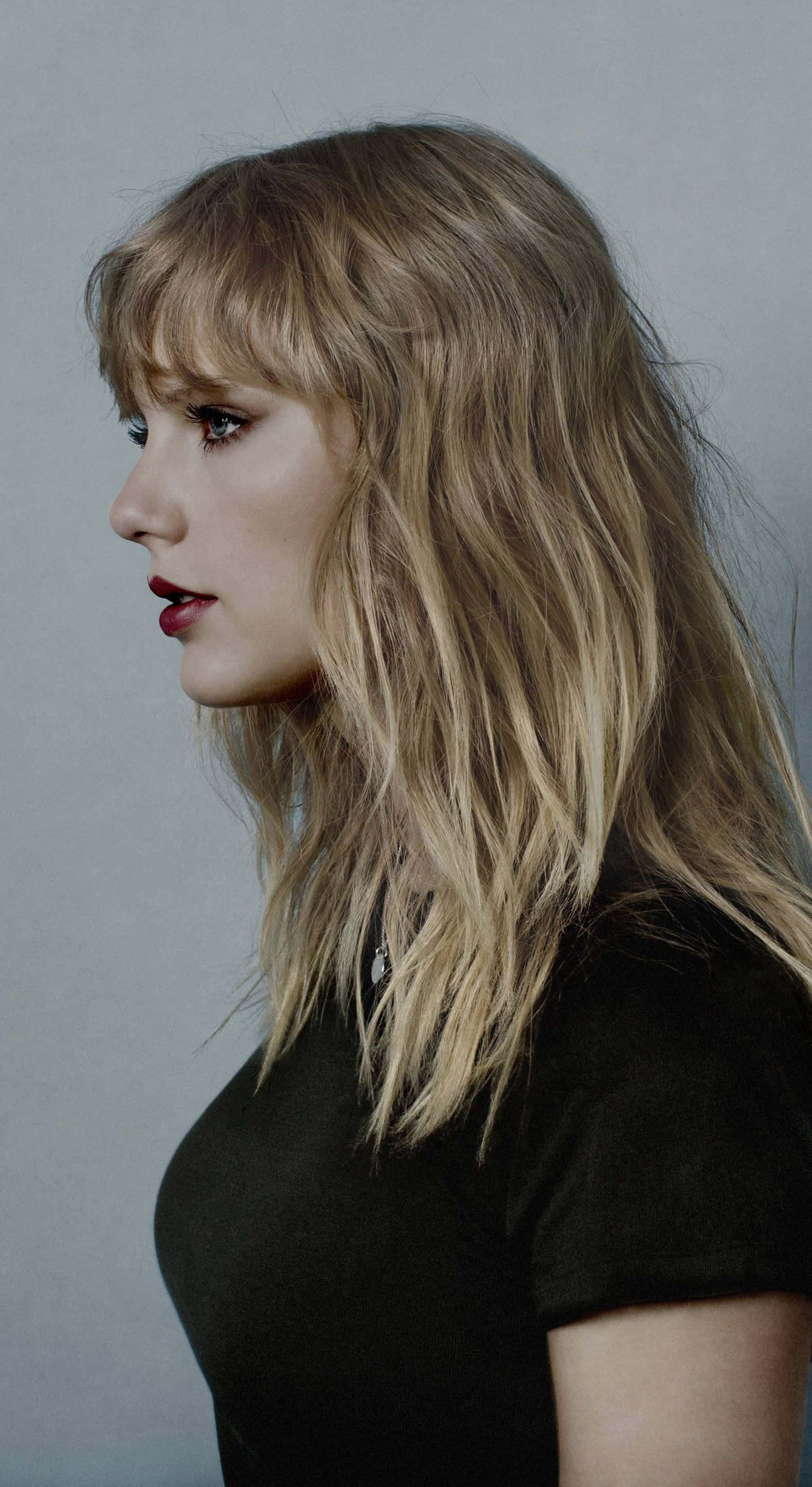 Bionder Taylor Swift iPhone Muurpapier