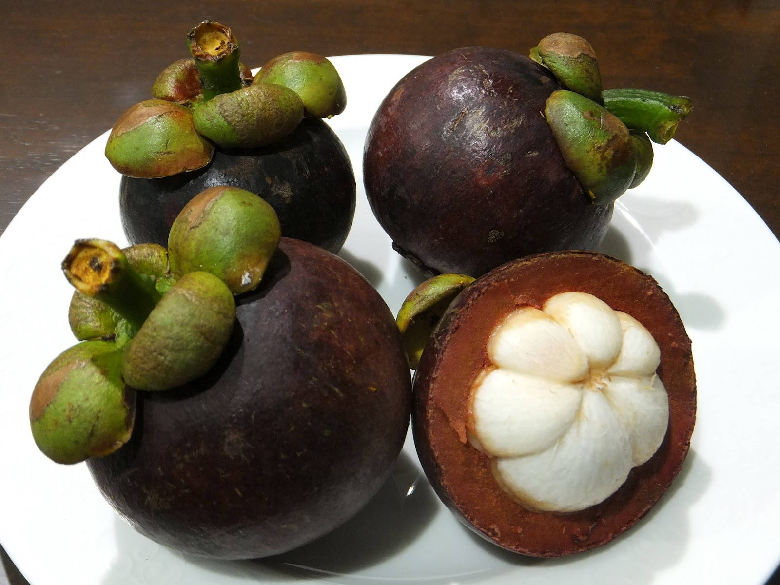 Byskrif: Sappige Mangosteen-vrug uit Costa Rica Muurpapier