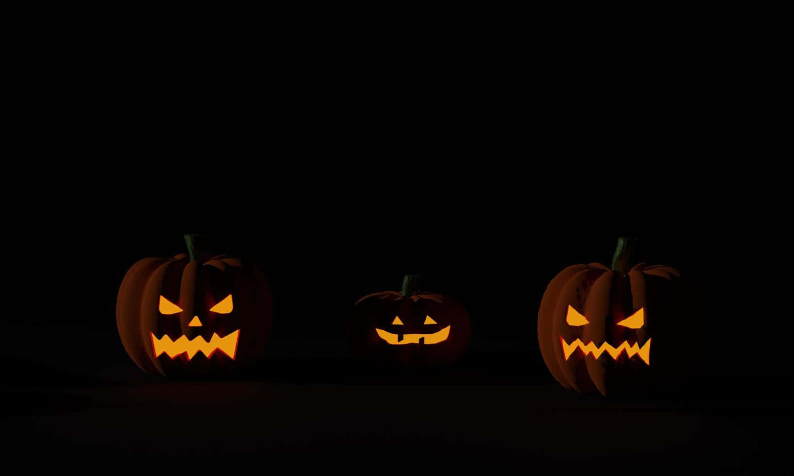 Drie Halloween Pampoen Agtergrond Donker Muurpapier
