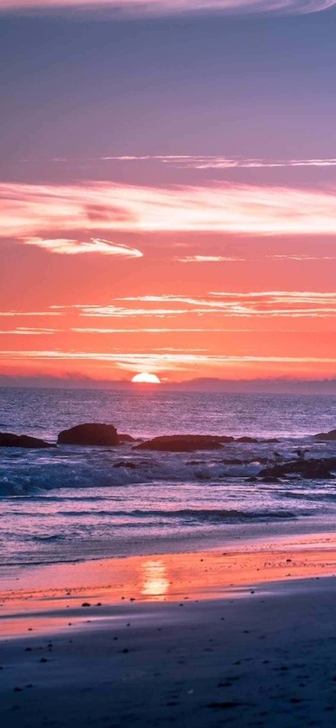 Ervaar die skoonheid van Malibu met die nuutste iPhone Xs Muurpapier