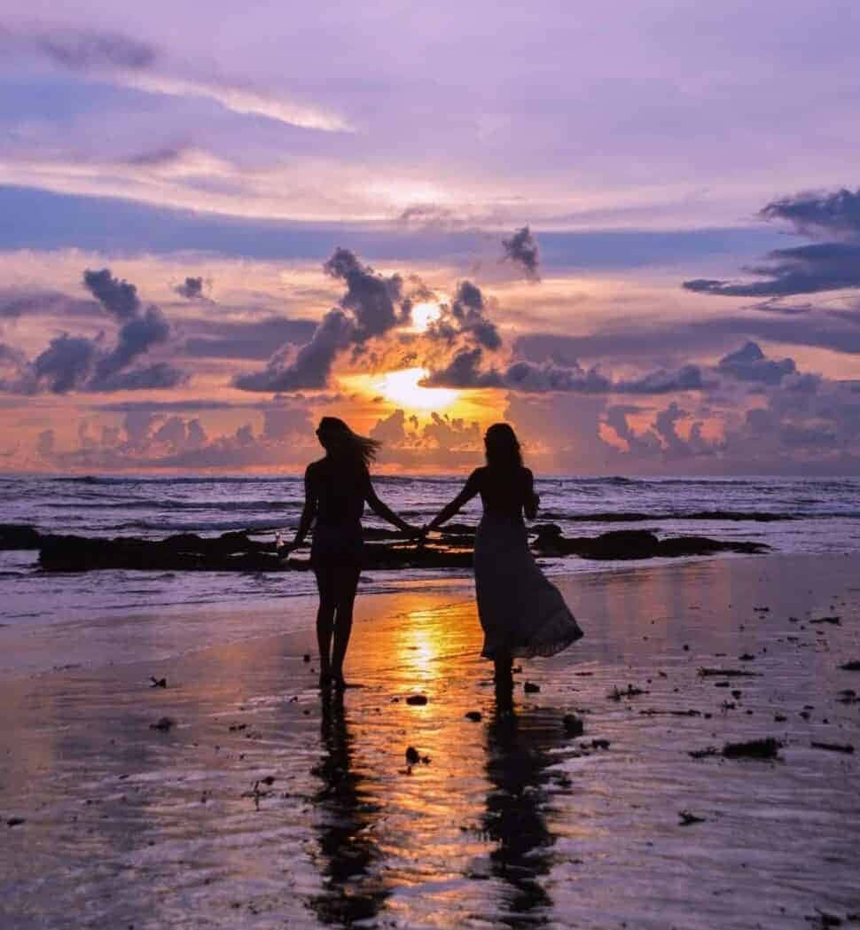 Ervaar die skoonheid van 'n asemrowende strand-sonsondergang Muurpapier
