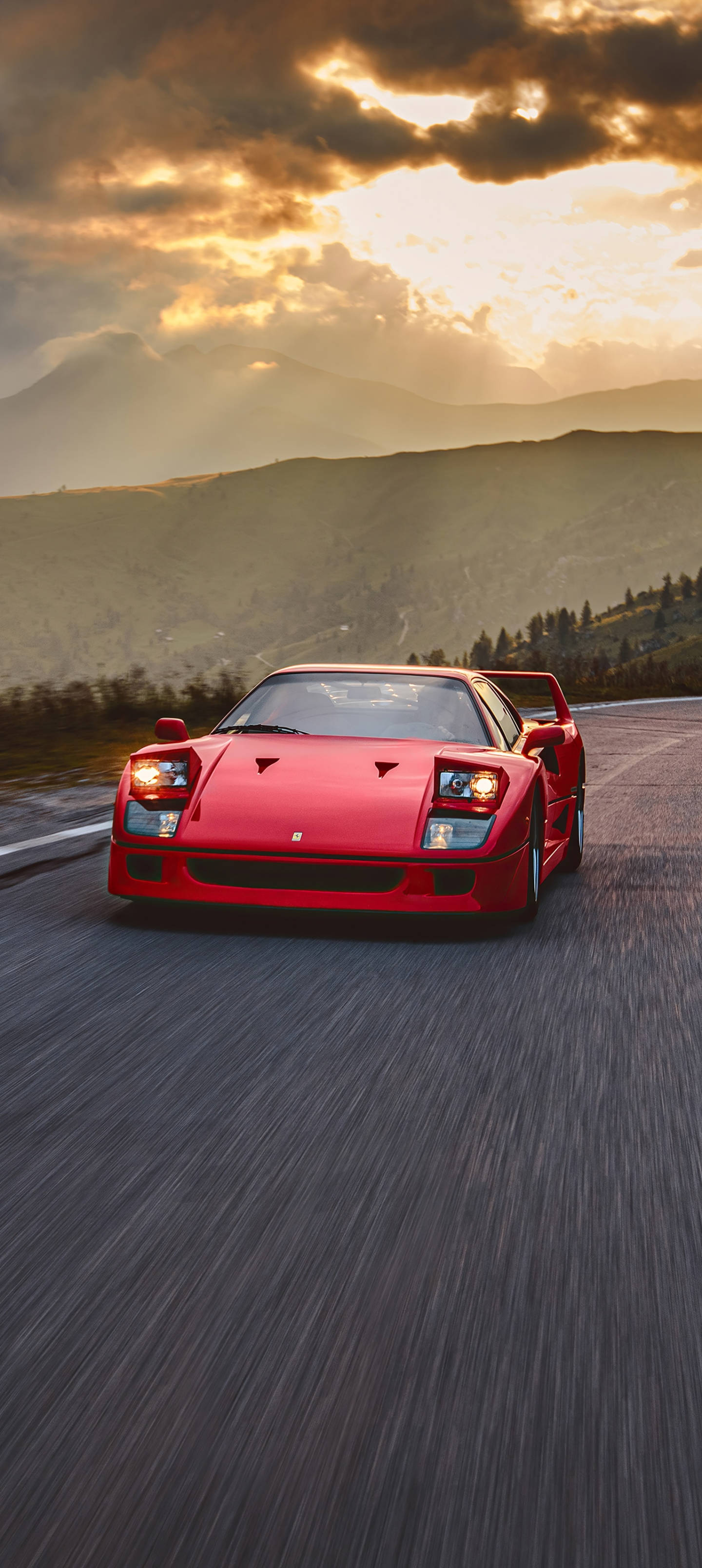 F40 Ferrari Foon tydens Sonsondergang Muurpapier