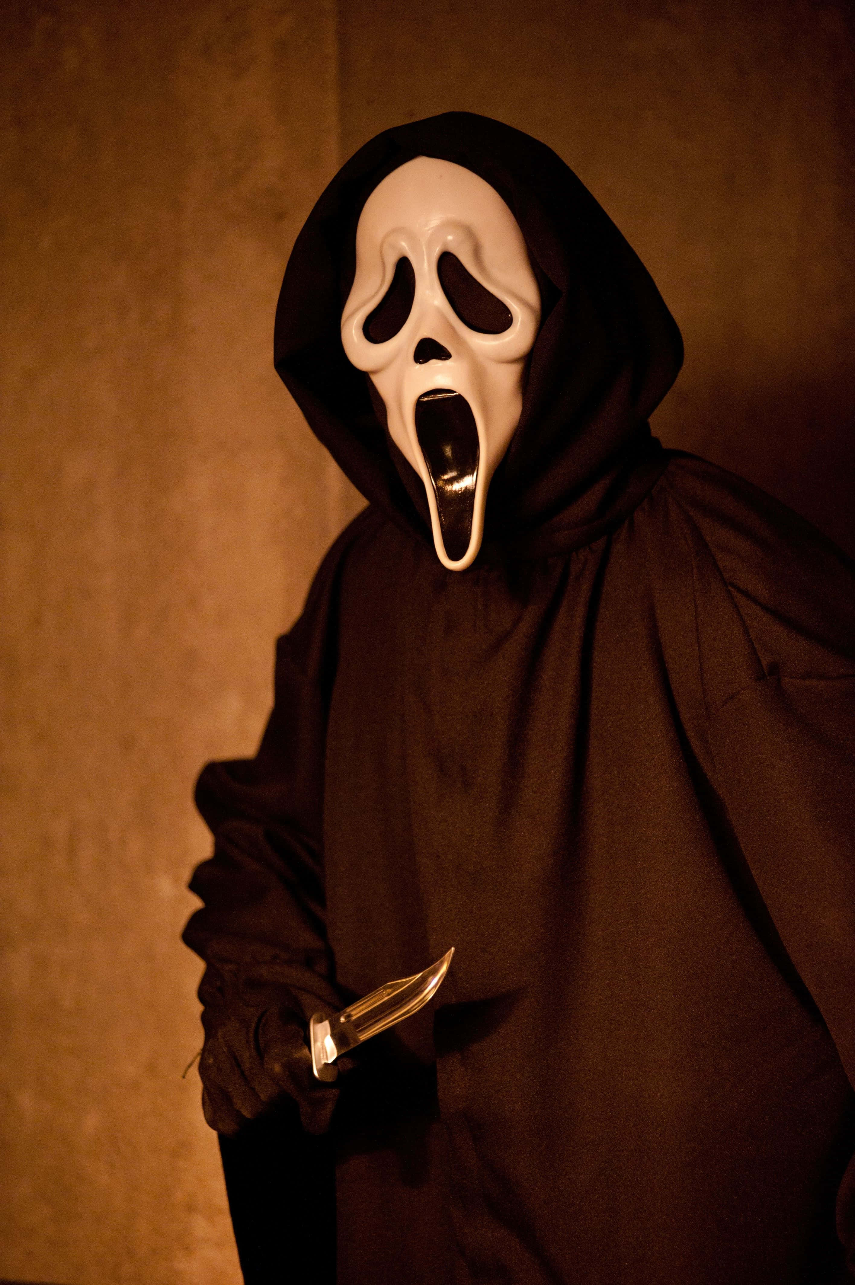 Geheimsinnige Ghostface in Skaduwees Muurpapier