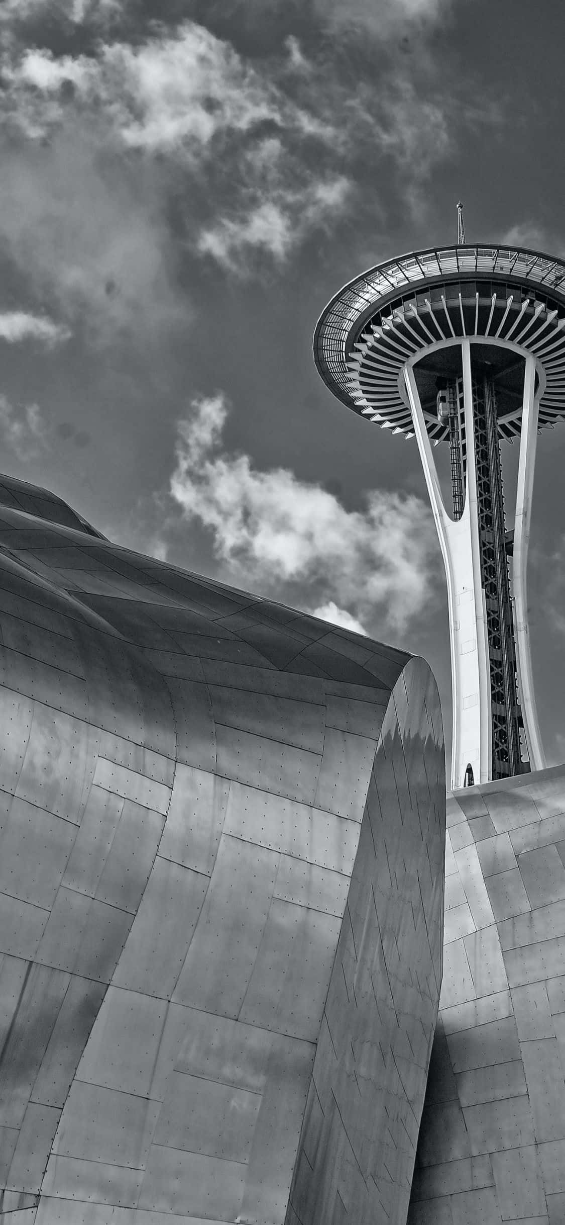 Geniet die asemrowende Seattle-hemelruim en ikoniese Space Needle deur die merkwaardige vertoning van die iPhone X. Muurpapier
