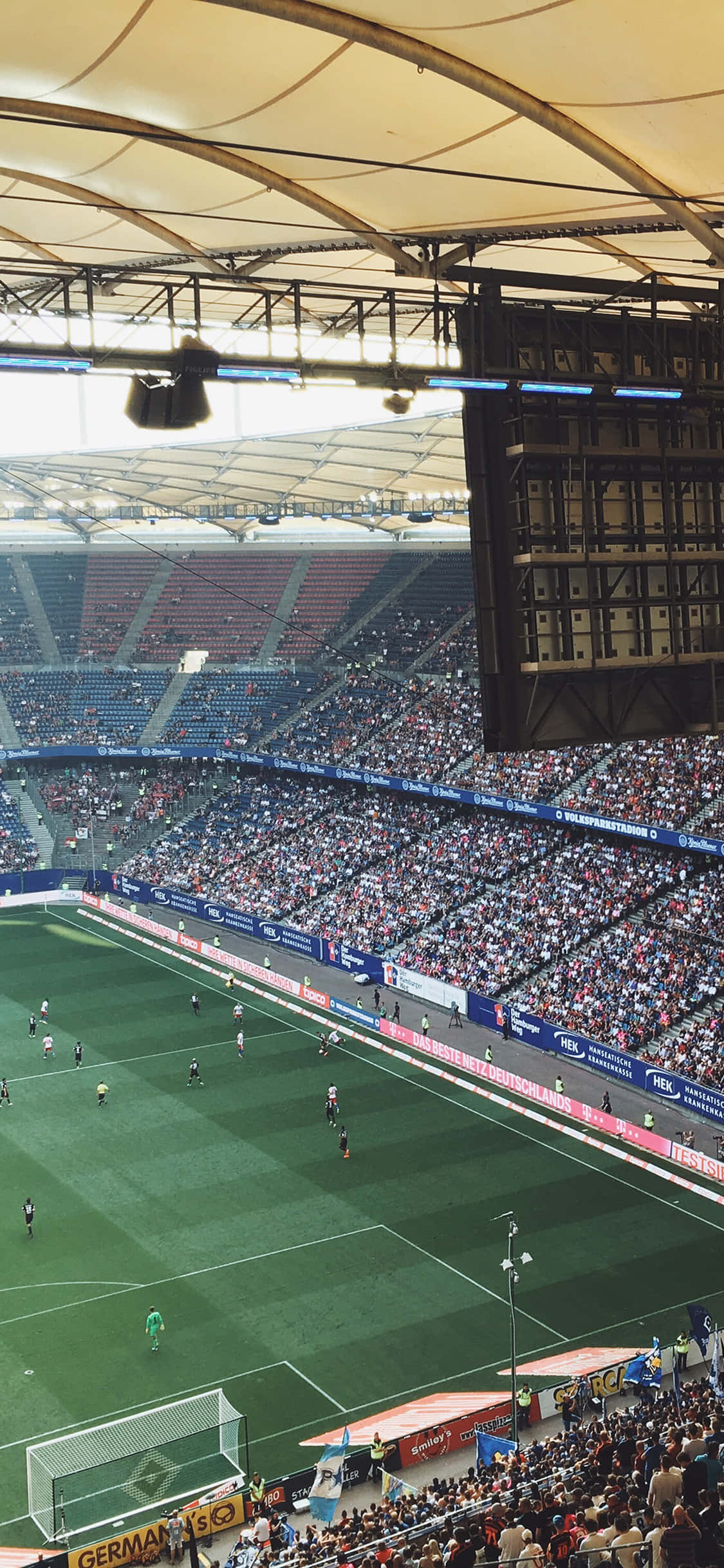 Geniet die elektriese atmosfeer van die Sokkerstadion Muurpapier