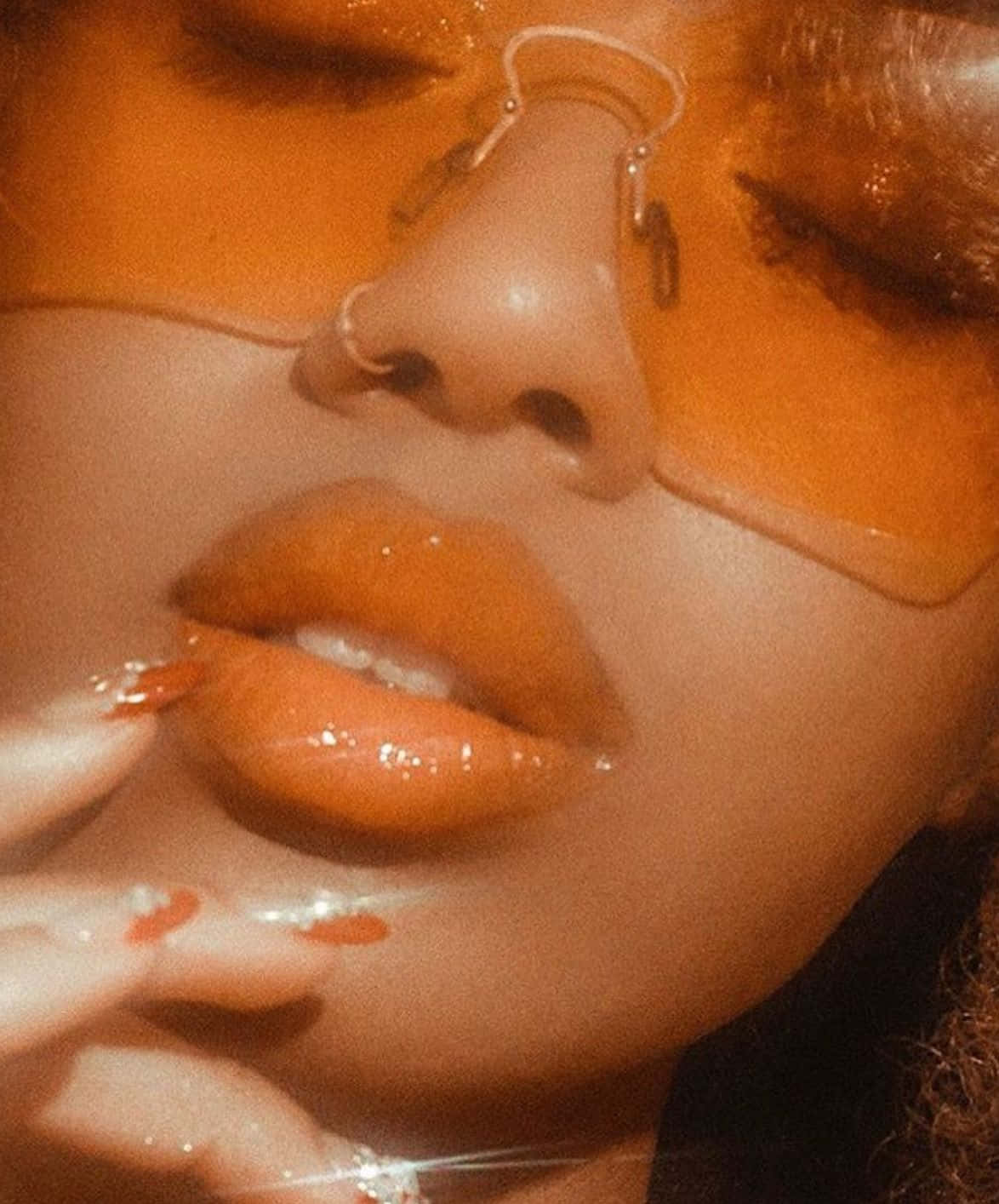 Geniet die lewendige kleure van die natuur met 'n oranje-estetika Muurpapier