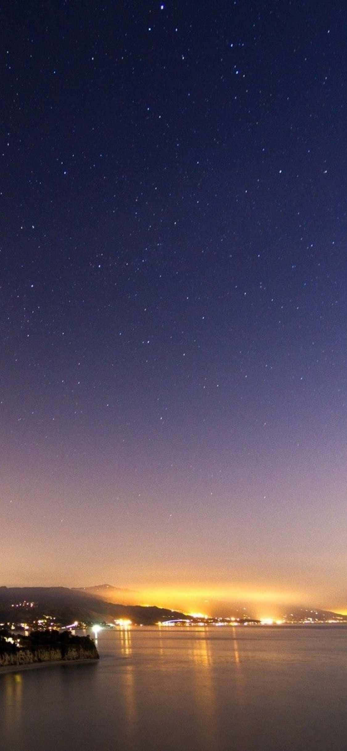 "Geniet die pragtige skoonheid van Malibu-strand met die wonderlike iPhone X" Muurpapier