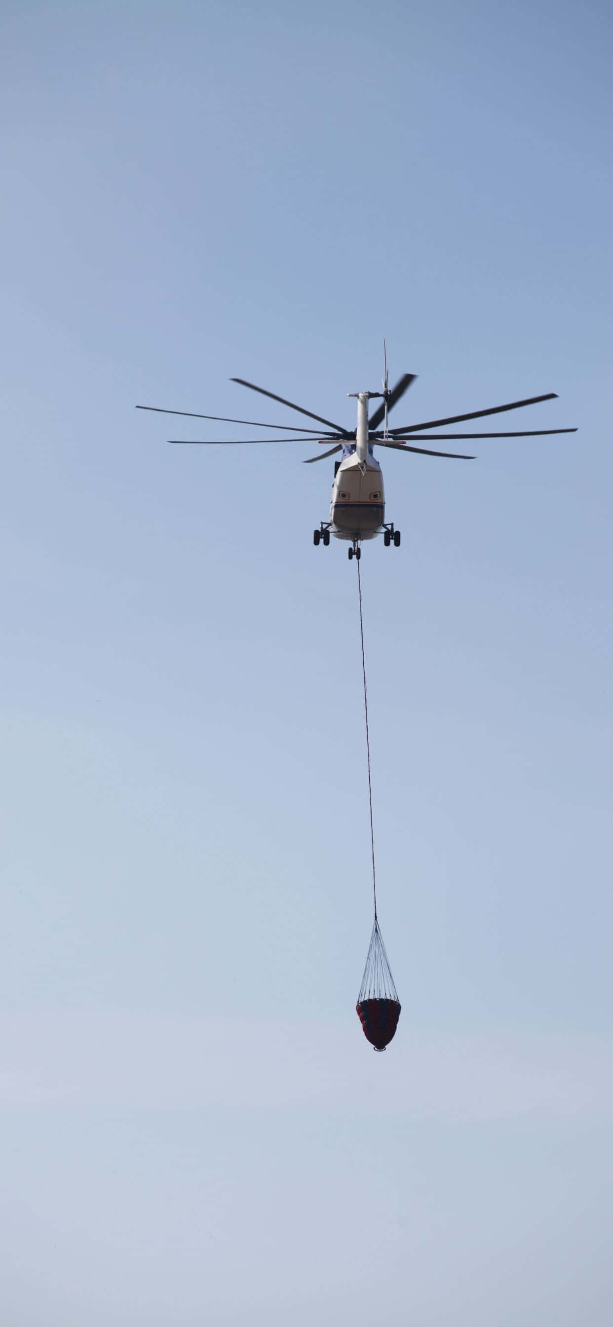 Geniet die rit van 'n leeftyd in die lug met die iPhone Xs Max Helikopters Muurpapier