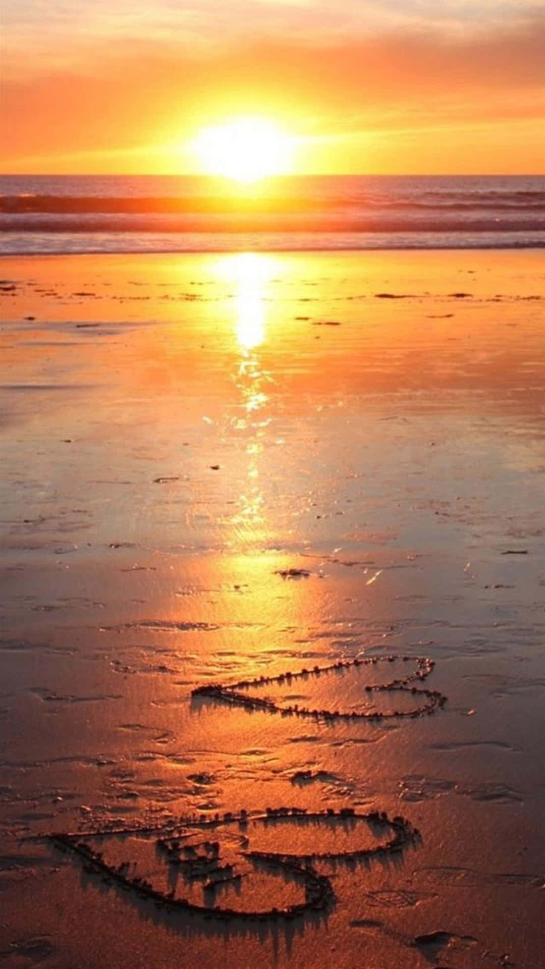 Geniet 'n Asemrowende Strandsonsondergang Muurpapier