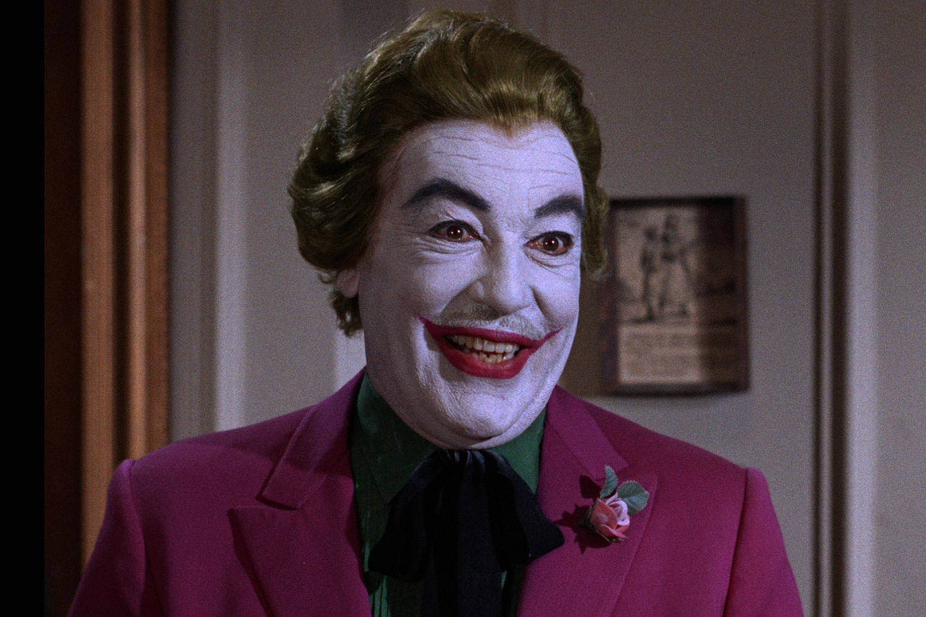 Glimlaggende joker Cesar Romero Muurpapier