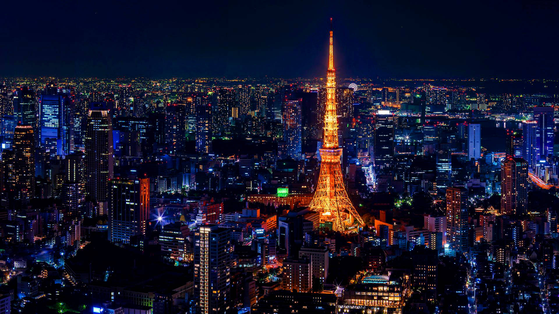 Goue Tokio Toring Kleurvolle Stadligte Muurpapier