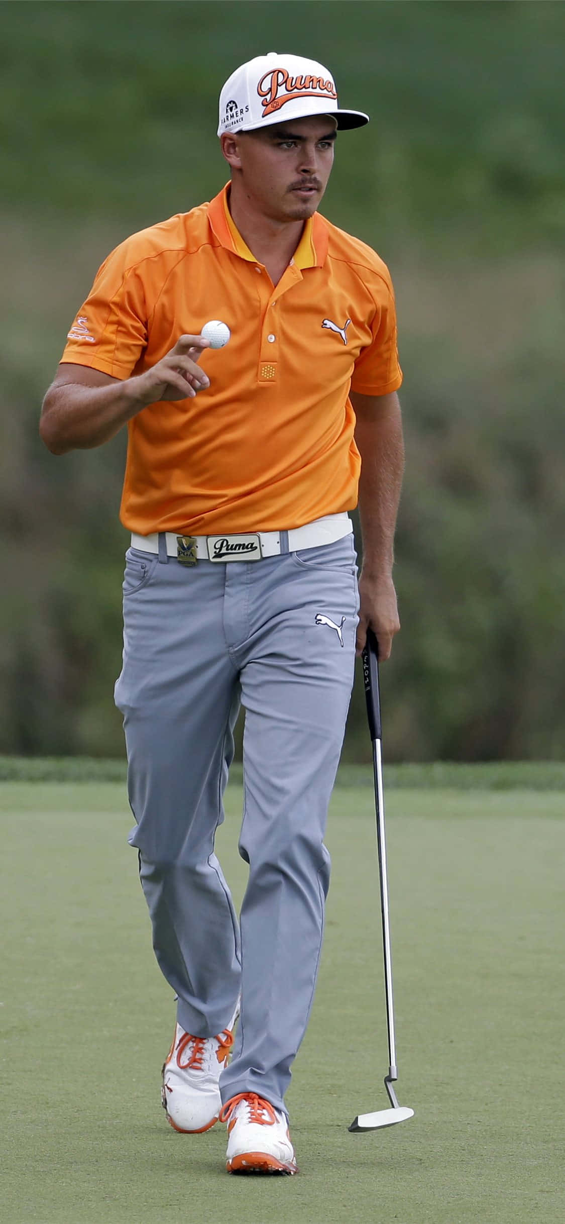 iPhone Xs Gholf-agtergrond met Rickie Fowler Muurpapier