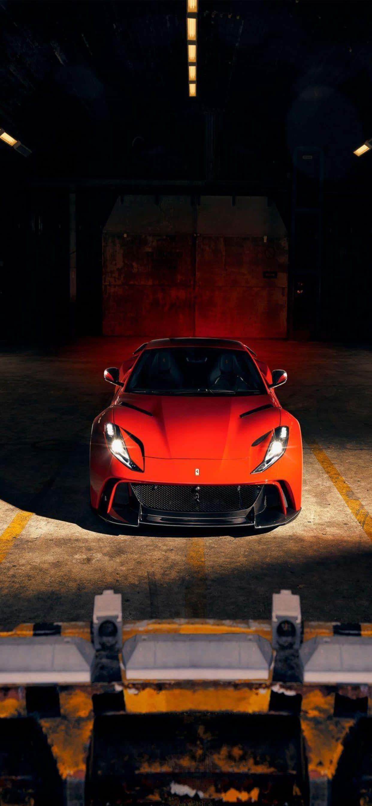 iPhone Xs Max Ferrari Agtergrond Rooi Ferrari 812 Superfast In 'n Pakhuis Muurpapier