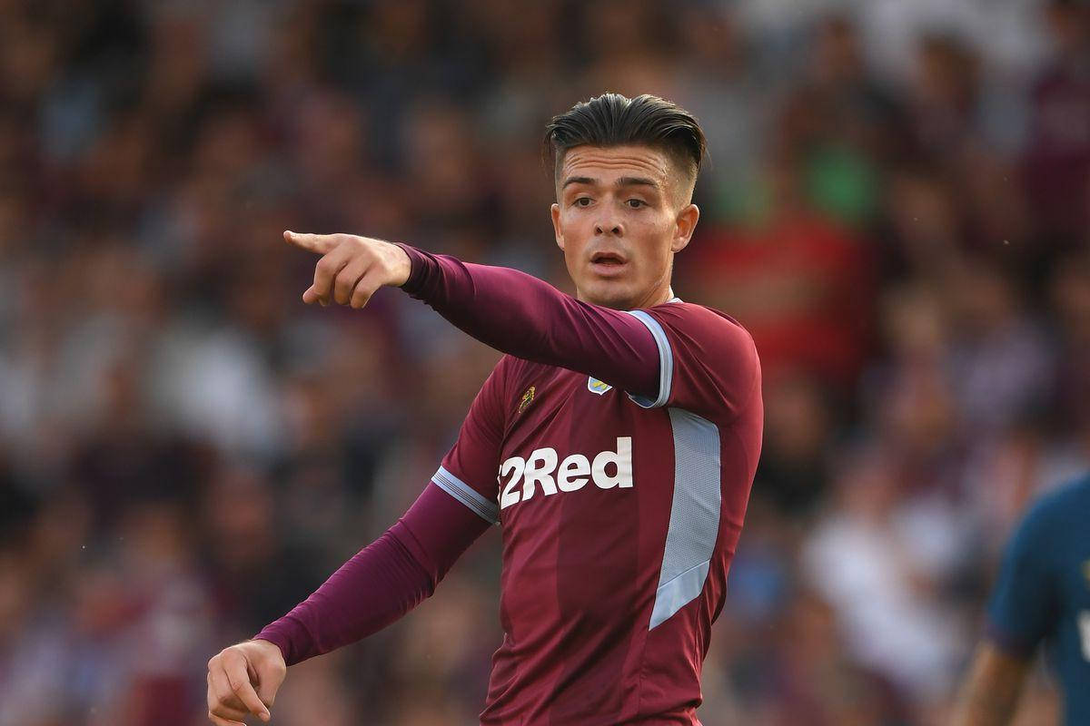 Jack Grealish wys na buite die raam Muurpapier