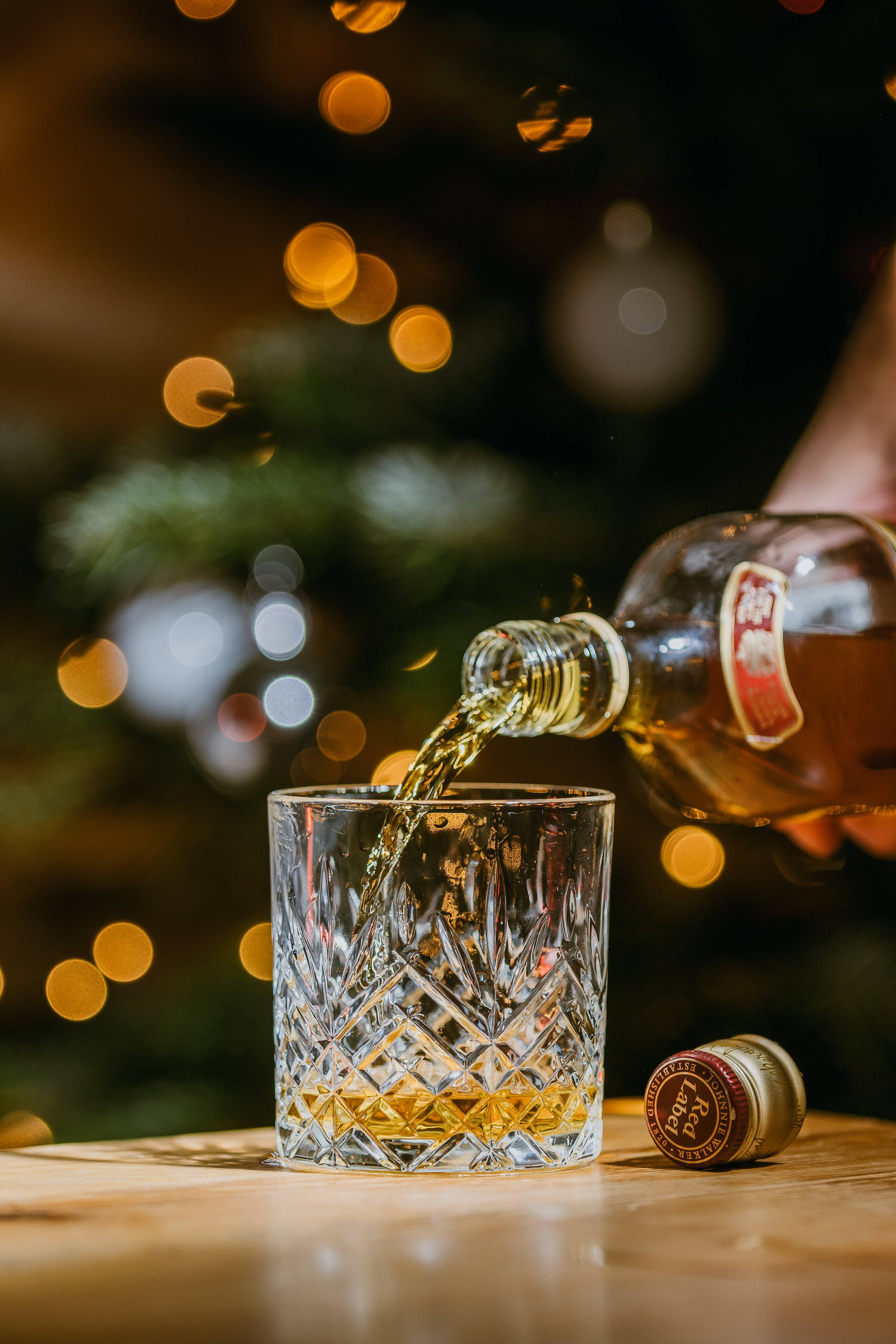 Kersfees Whiskey Word Gegoes Op Glas Muurpapier
