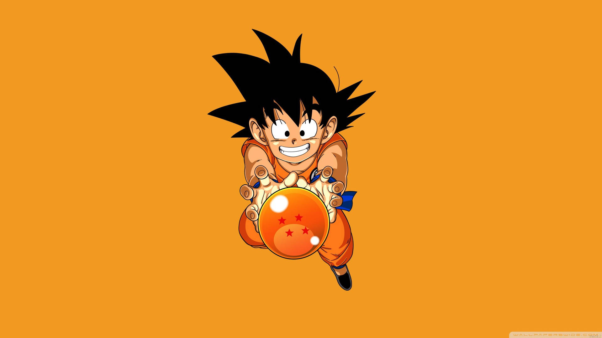 Behangpapier van Kind Goku wat die 4-ster Drakebal vashou.