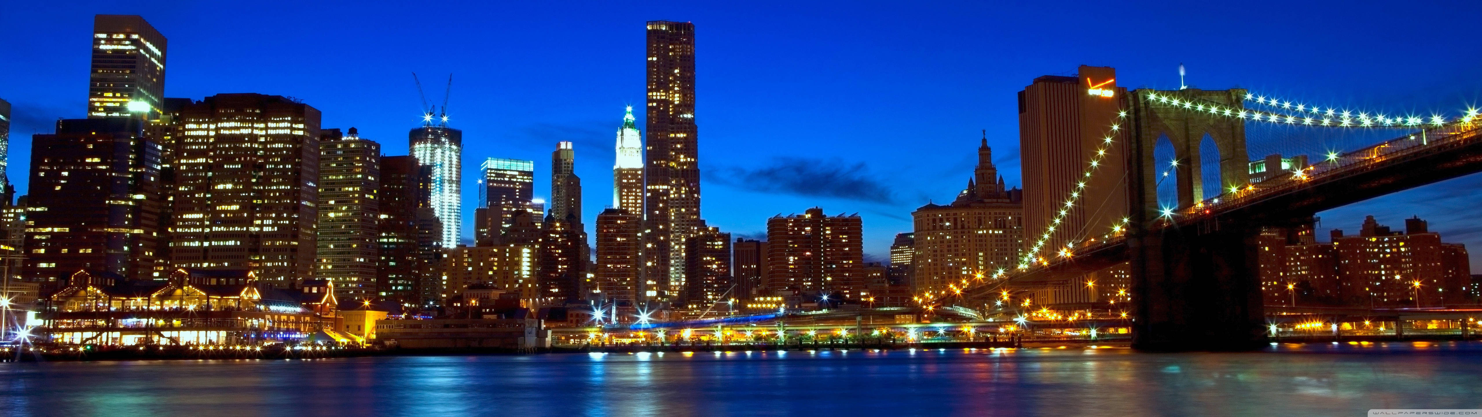 Lewendige Manhattan Stadlandskap Tydens Sonsondergang Muurpapier
