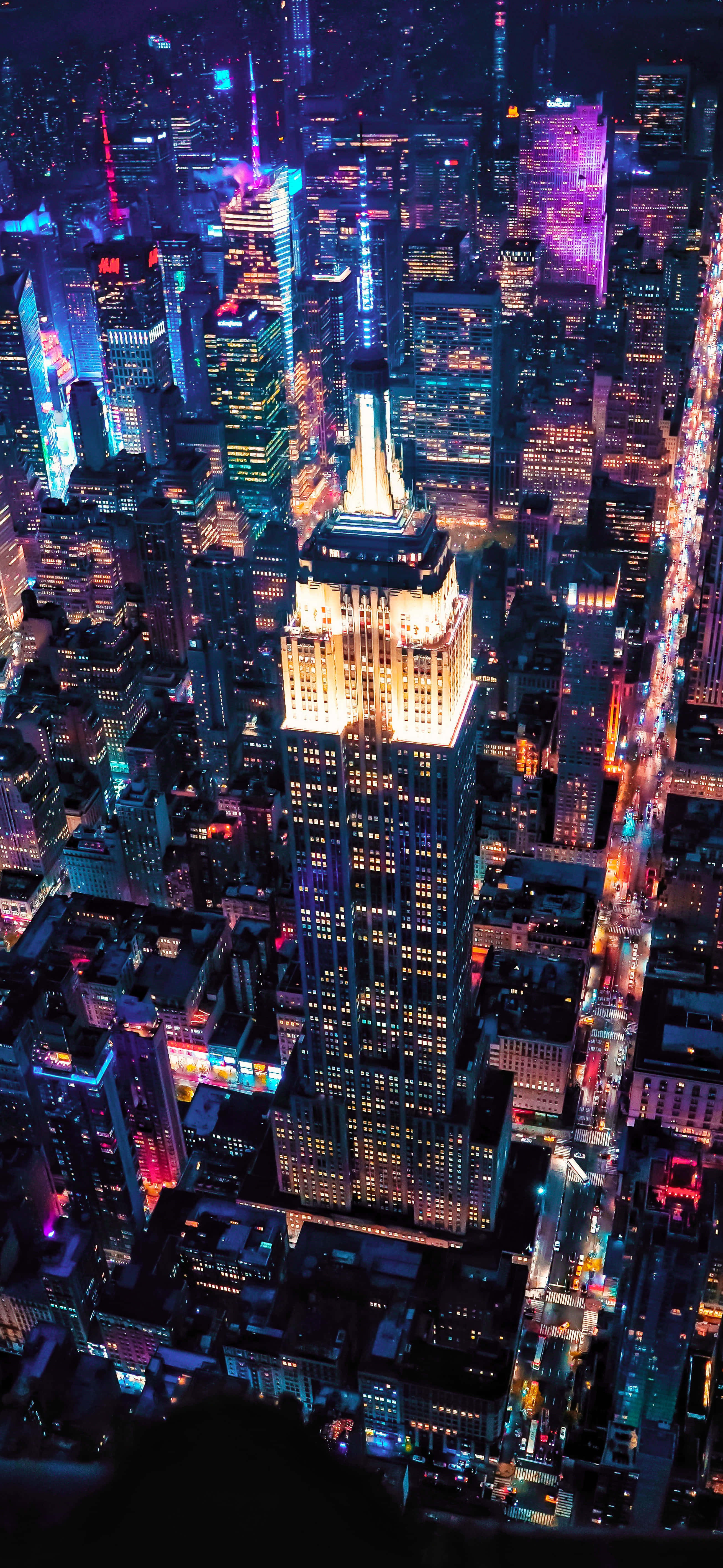 Lugfoto van die Donker Stad Geboue 4K Foon Agtergrond Muurpapier