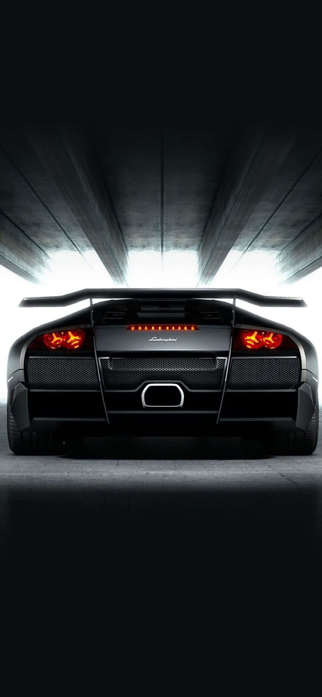 Luukse ervaring - besit 'n Swart Lamborghini-slimfoon Muurpapier