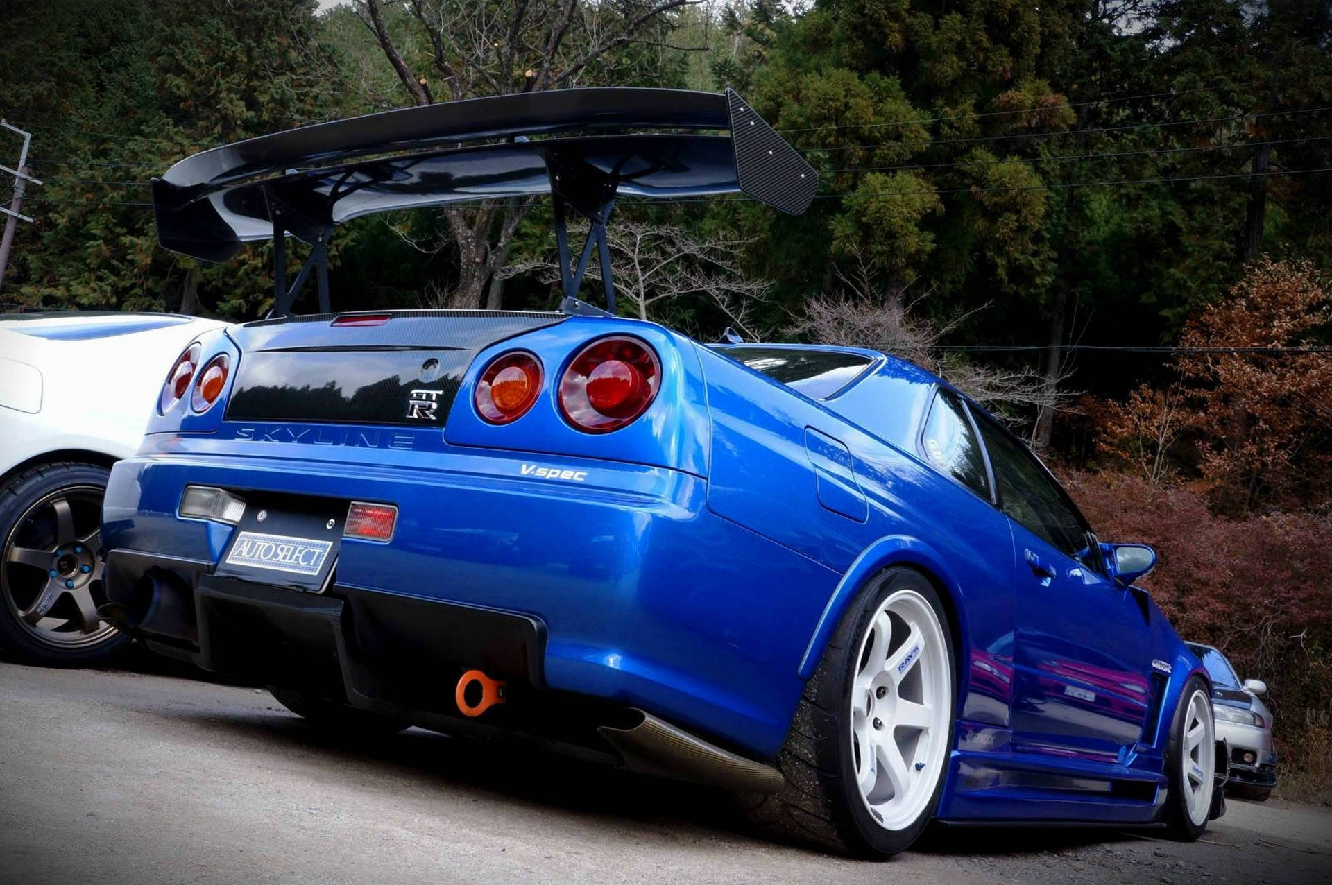 Majestueuse skoot van 'n Nissan Skyline GTR R34 in hoë-definisie. Muurpapier