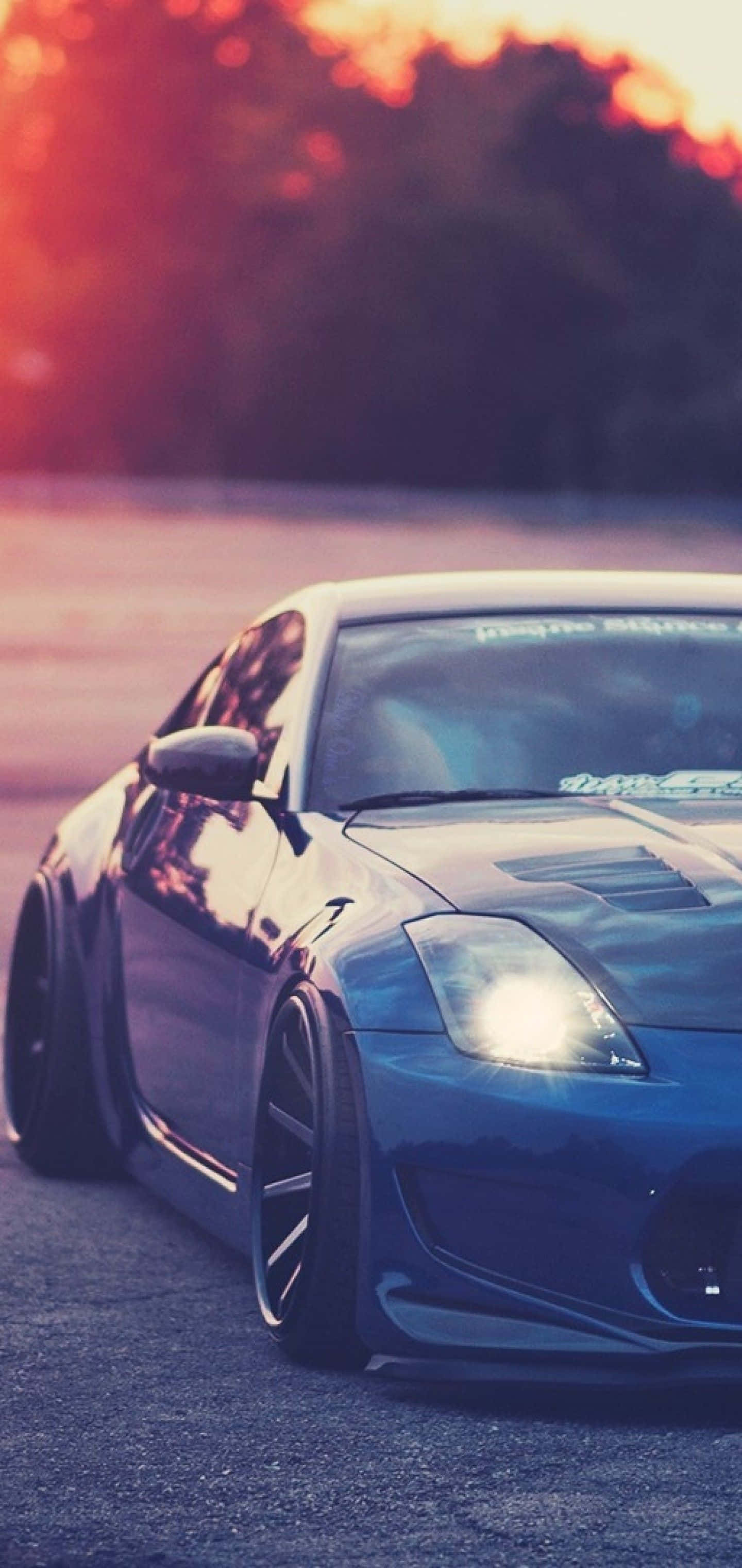 Metaalblou Nissan 350Z-selfoon Muurpapier