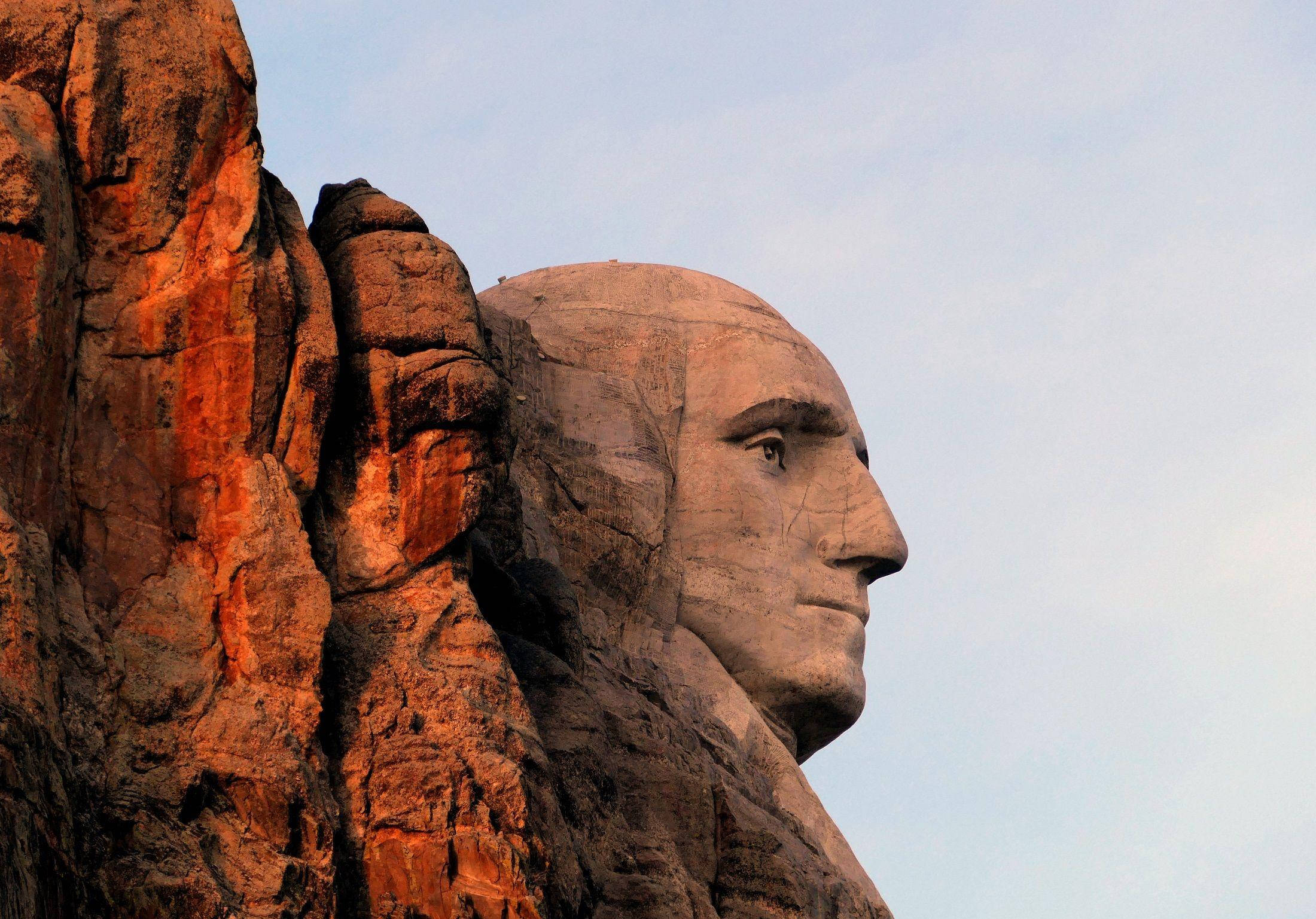 Mount Rushmore Abraham Lincoln in Goue Uur Muurpapier