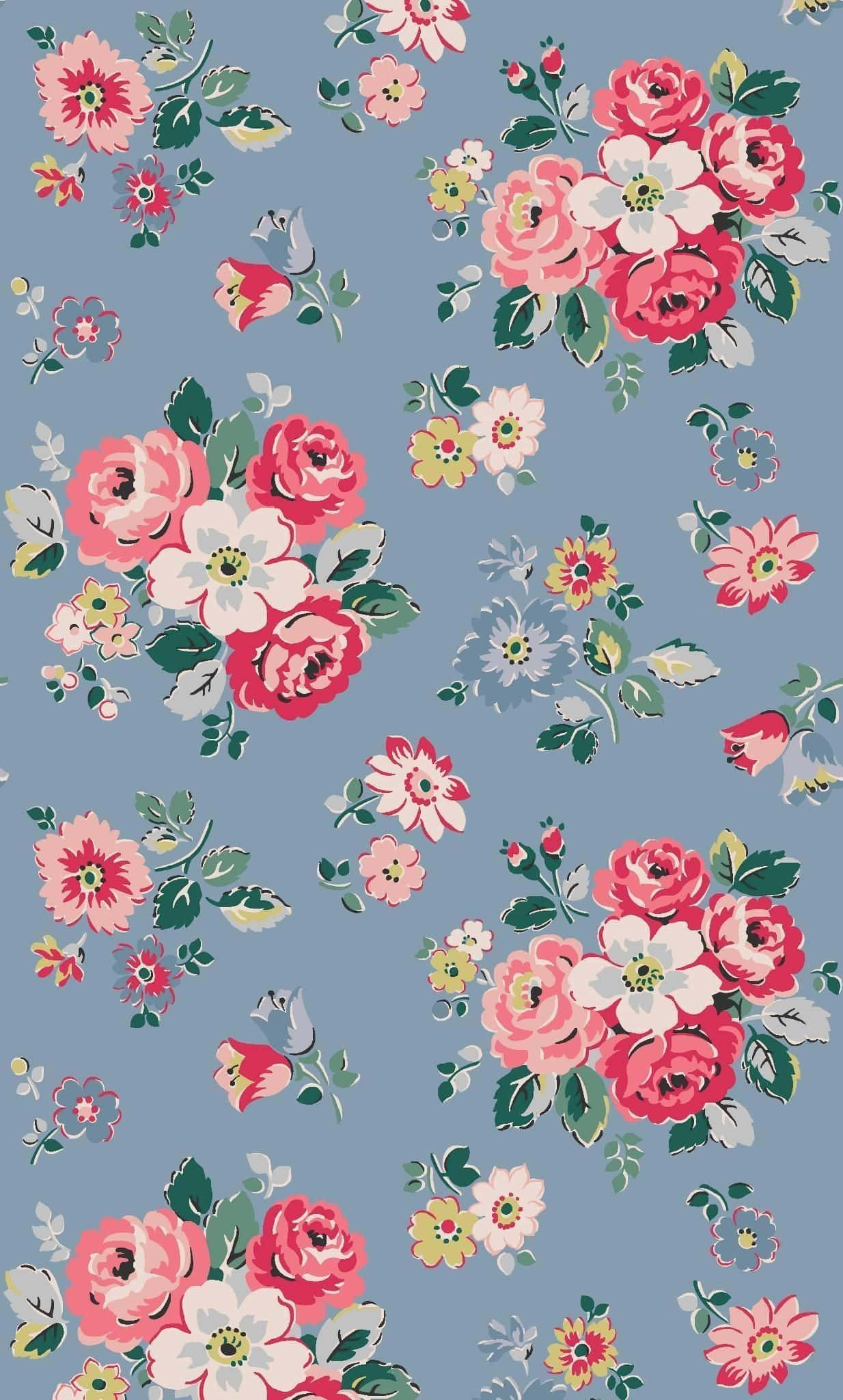 'n blompatroon op 'n blou agtergrond Muurpapier