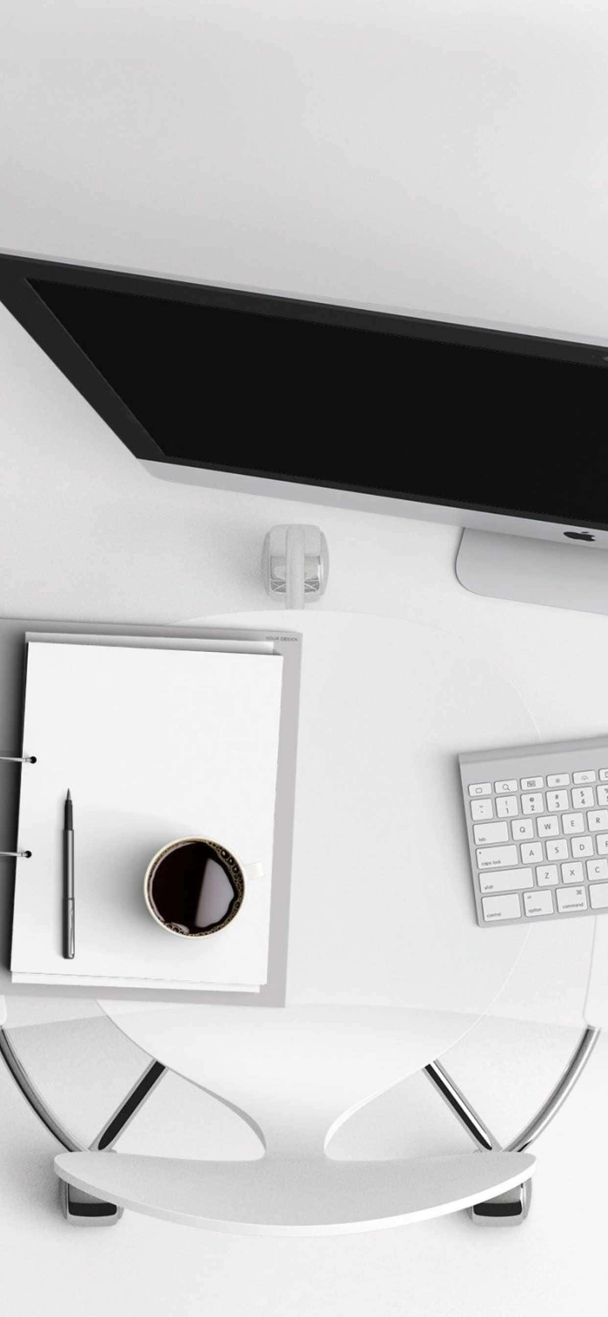'n wit lessenaar met 'n monitor, sleutelbord en koppie koffie Muurpapier