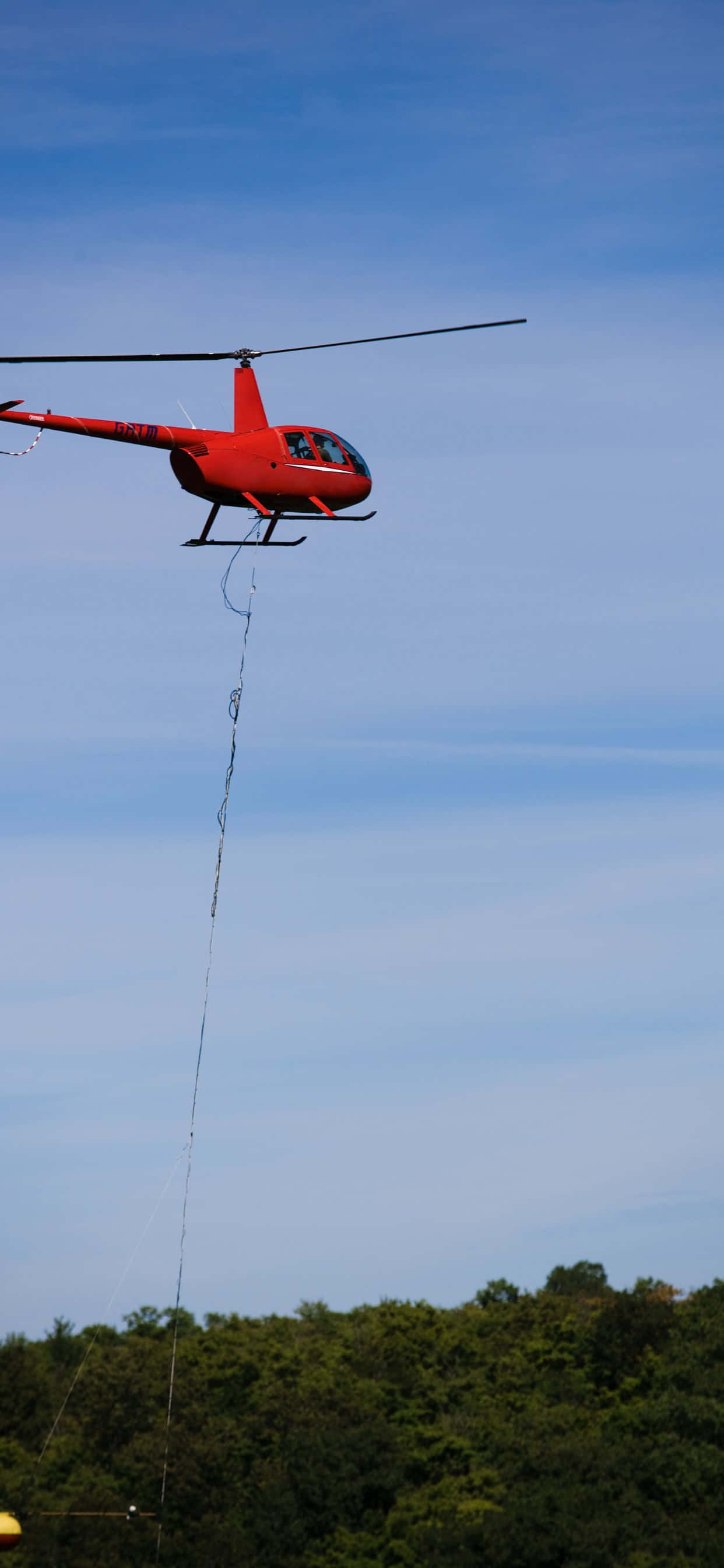 Neem jou iPhone Xs Max na nuwe hoogtes met 'n asemrowende lugbeeld van 'n helikopter Muurpapier