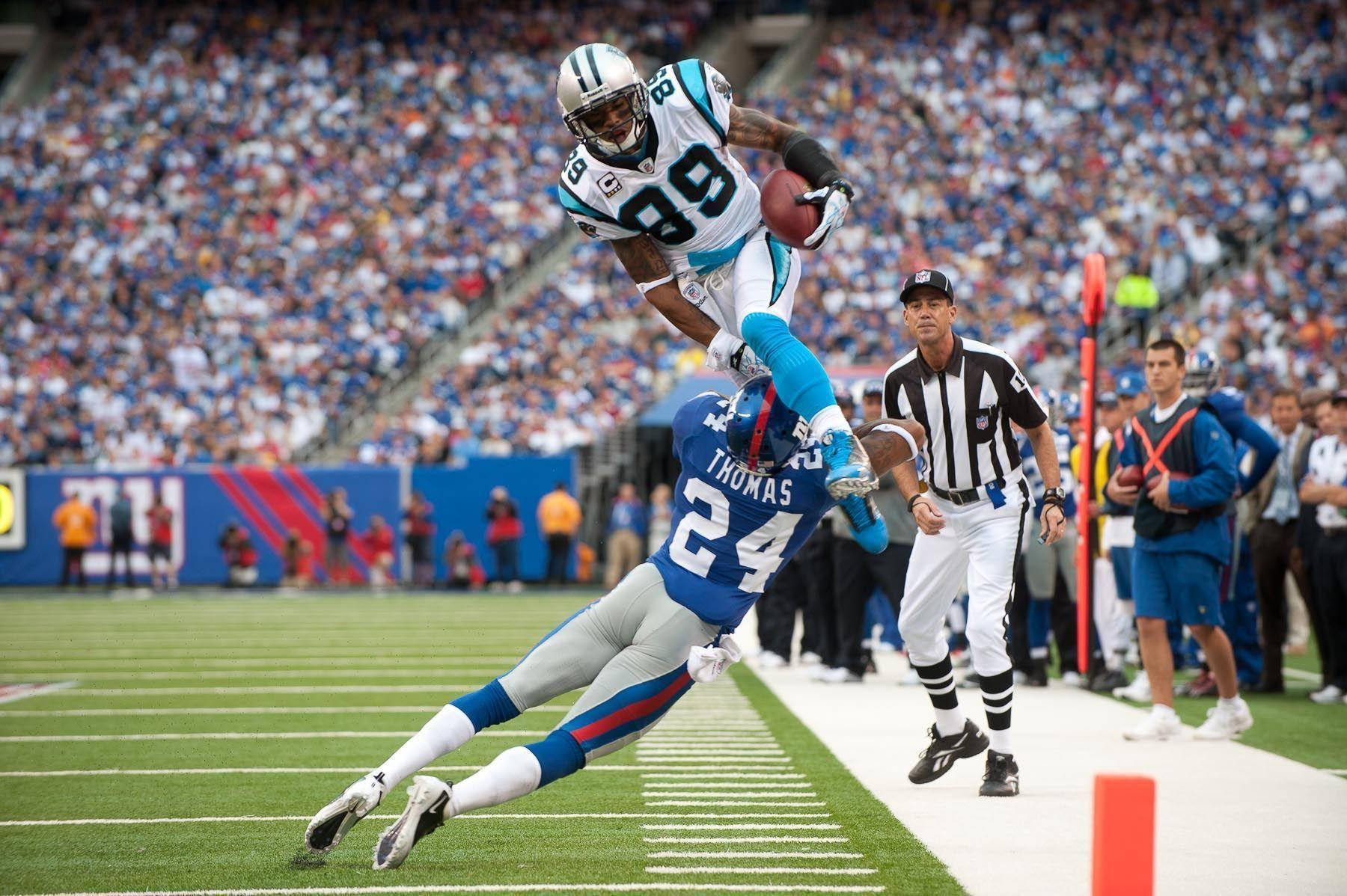 NFL Sokkerspelers in Botsing Muurpapier
