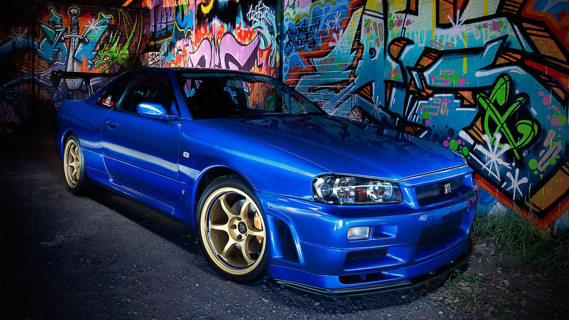 Nissan Skyline GTR R34 naby Graffiti Muurpapier