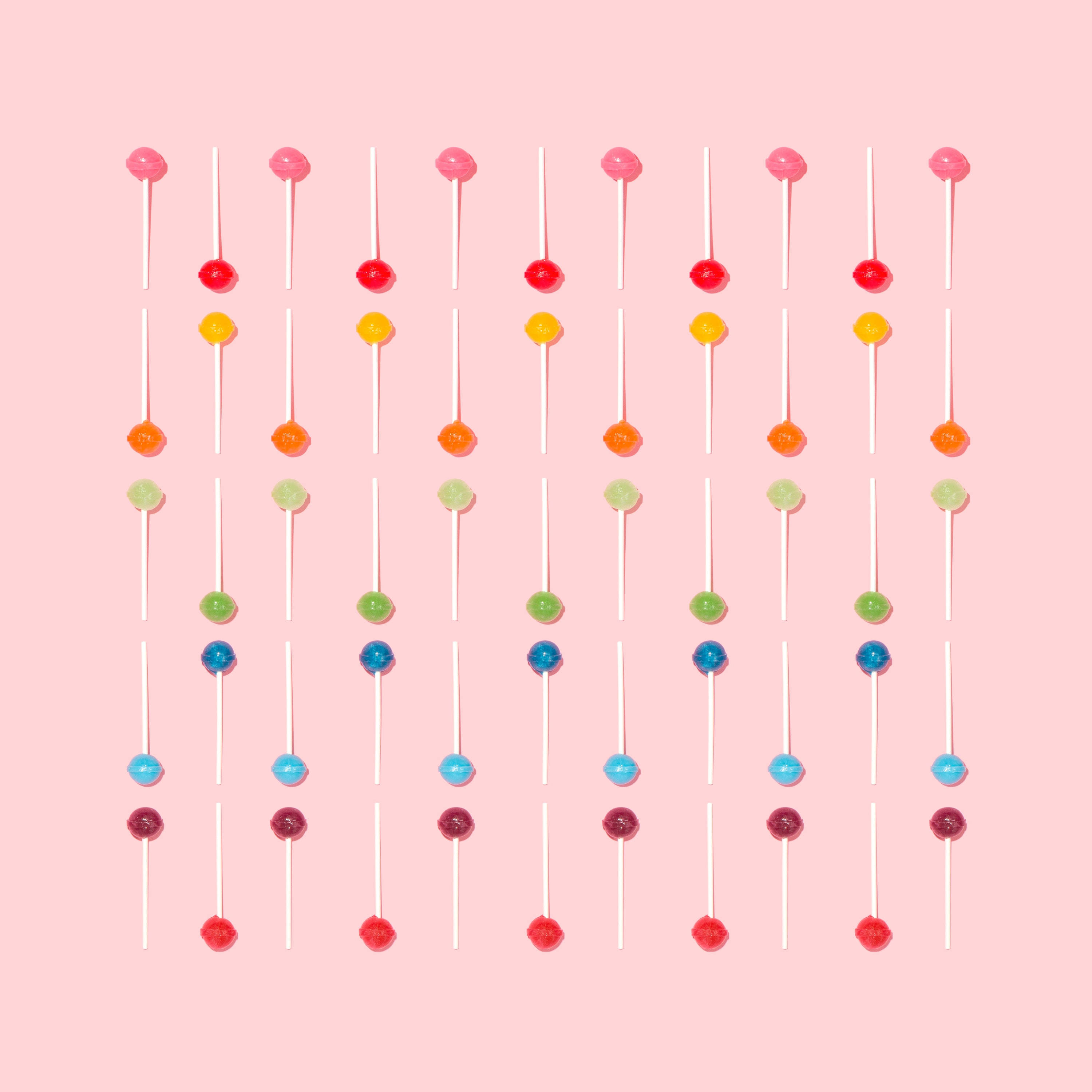 Onderskrif: Lewendige Lollipop Estetiese Patroon Muurpapier