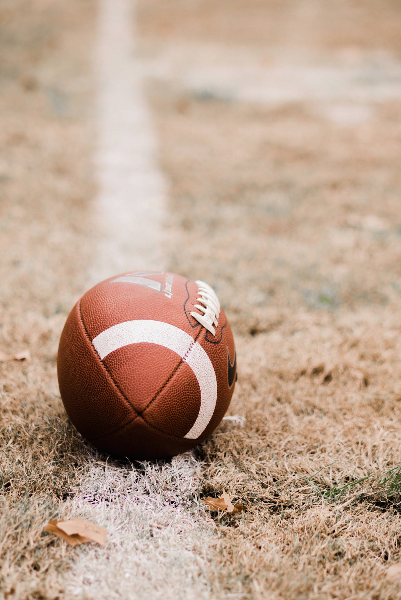 Amerikaanse voetbal varkvel bal selfoonagtergrond. — Sokker GIF Muurpapier