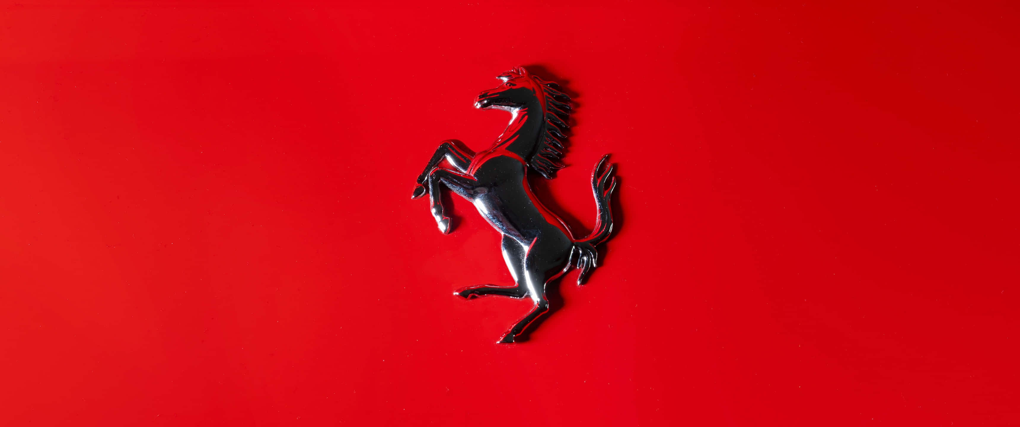 Oogtreffende Ferrari-handelsmerk-logo-agtergrond Muurpapier