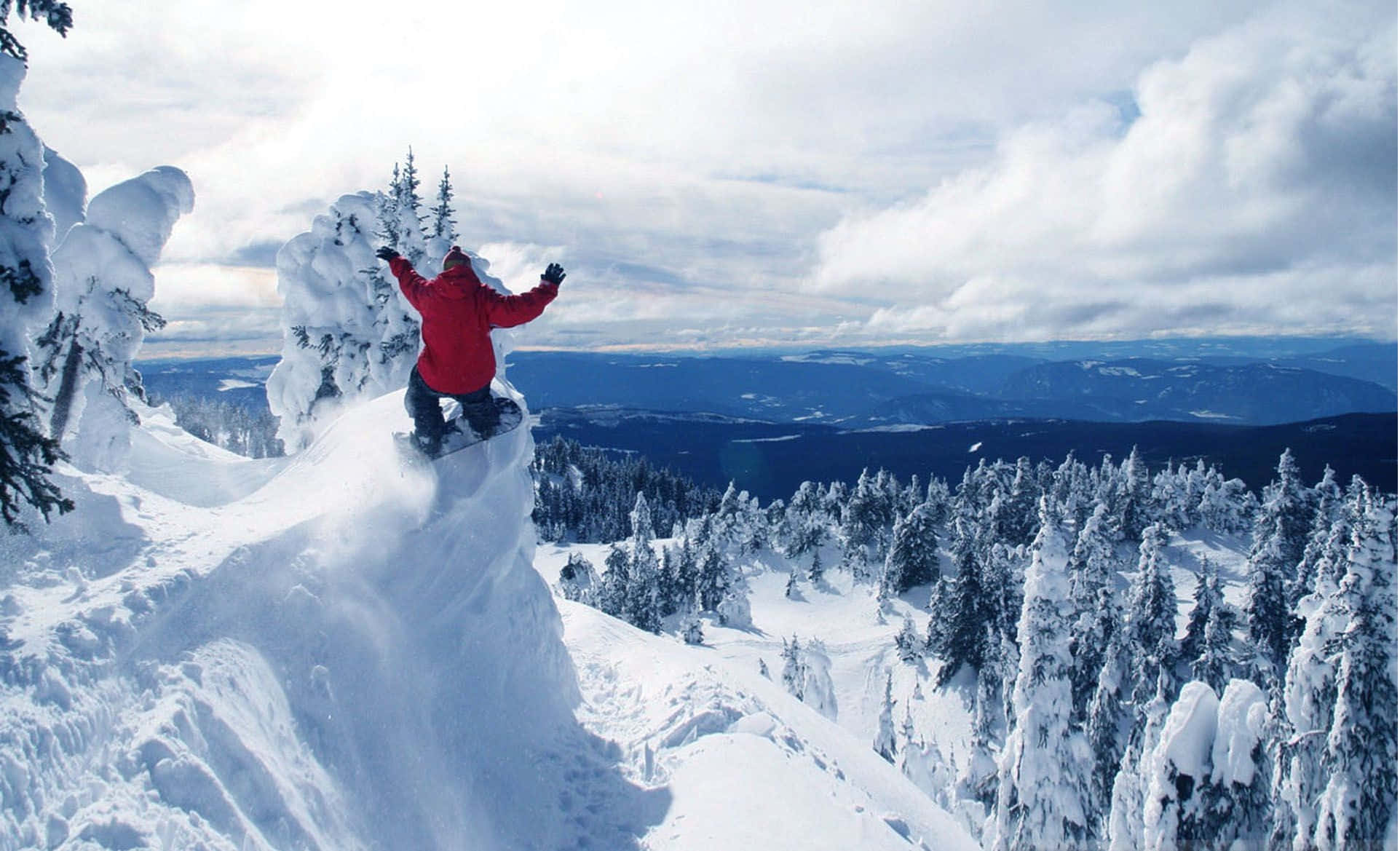 Opwindende Wintersport op die Sneeubedekte Berg Muurpapier