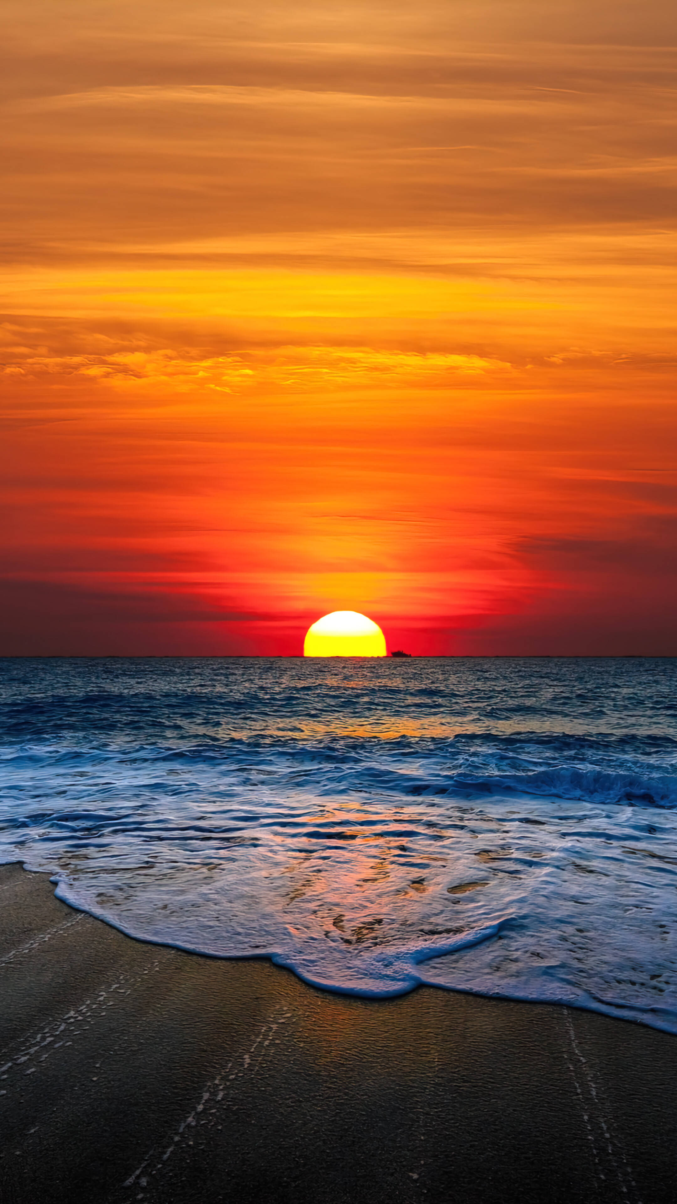 Oranje Sonsondergang bo Strand Android Muurpapier