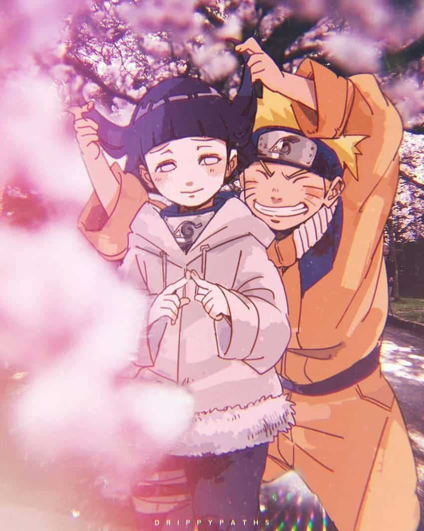 Oulike Naruto en Hinata by die Kersiebloesempark Muurpapier