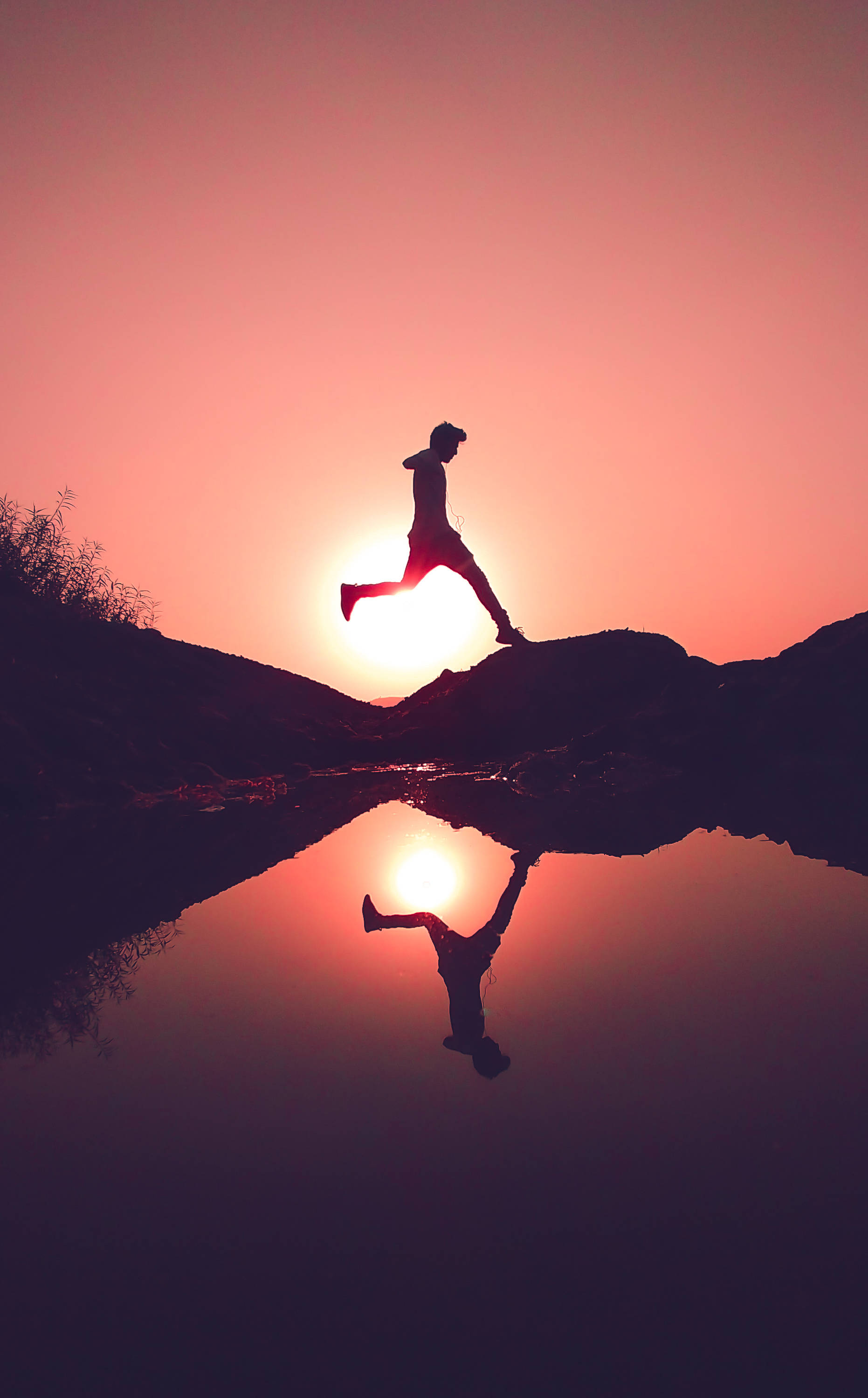 Parkour Man teen Sonsondergang Muurpapier