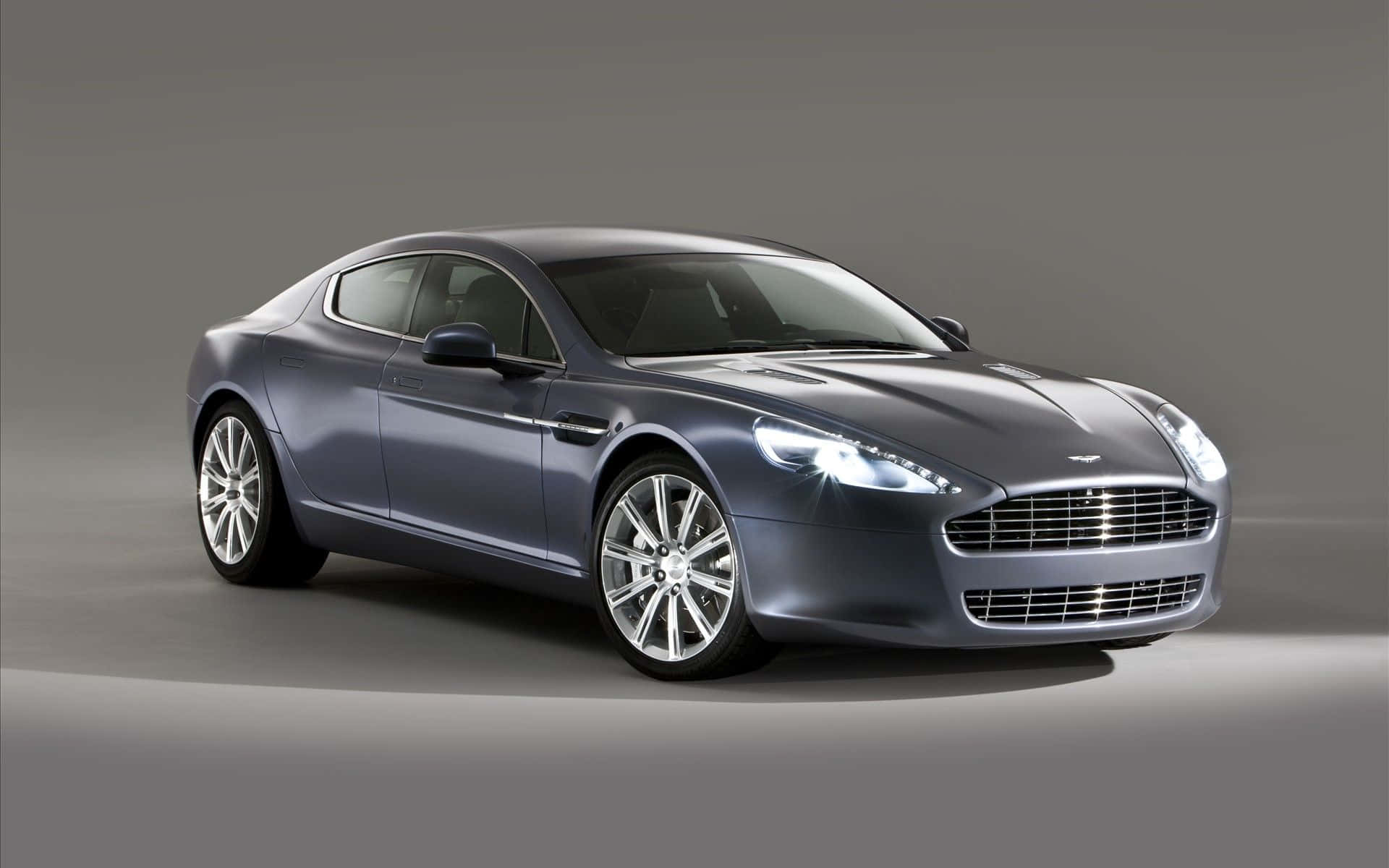 Pragtige Aston Martin Rapide S in beweging Muurpapier