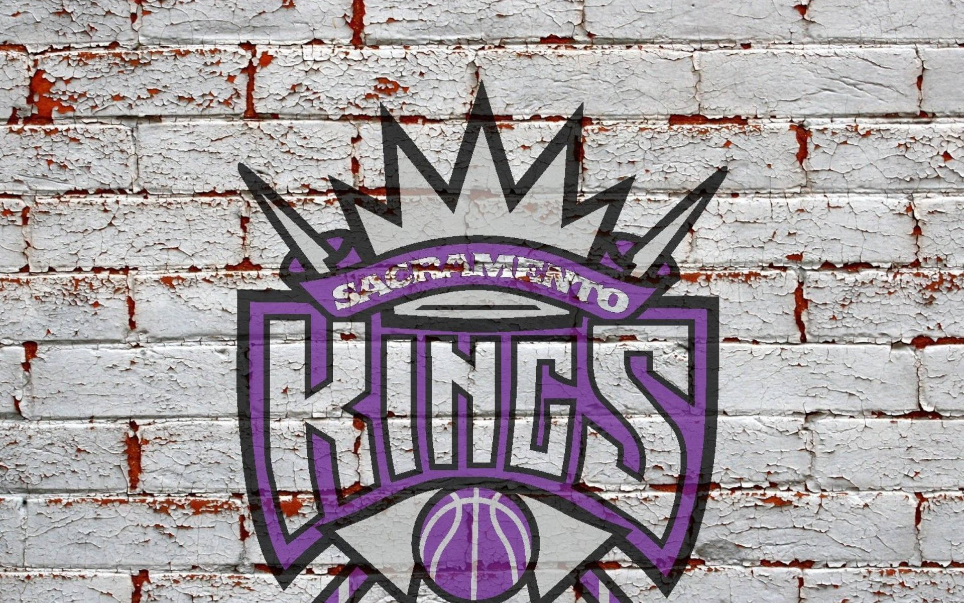 Sacramento Kings-logo in Baksteenmuur Muurpapier