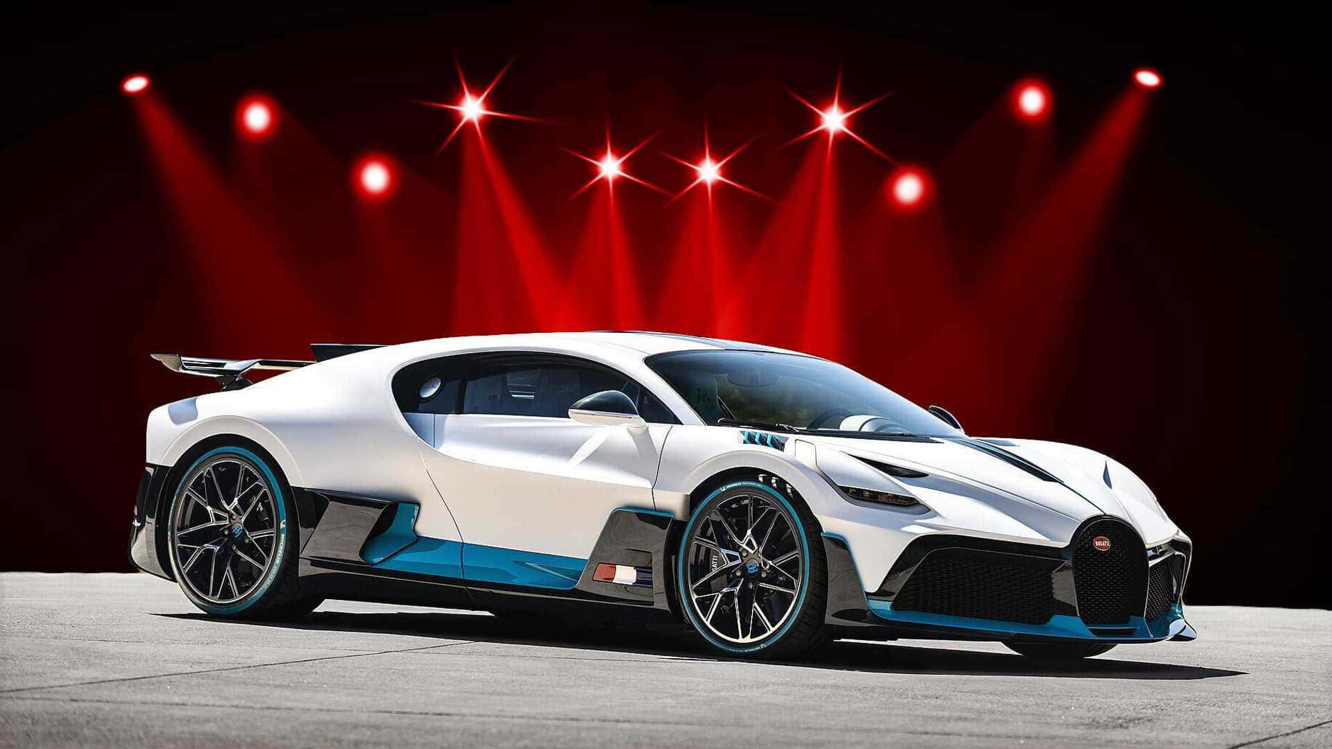 Sekere Rooi Sportmotor teen Sonsondergang Muurpapier