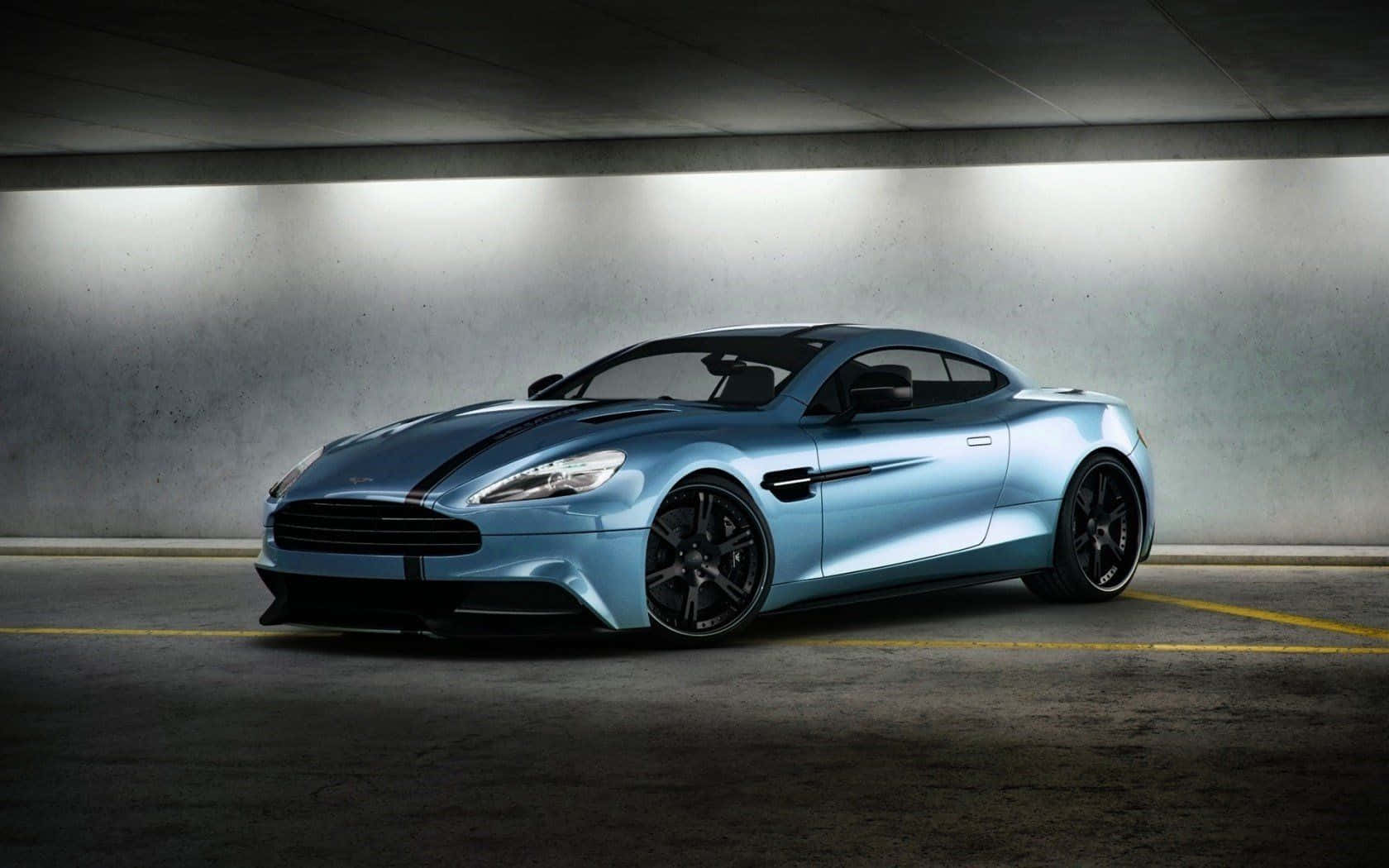 Sierlike Aston Martin Vanquish in Aksie Muurpapier