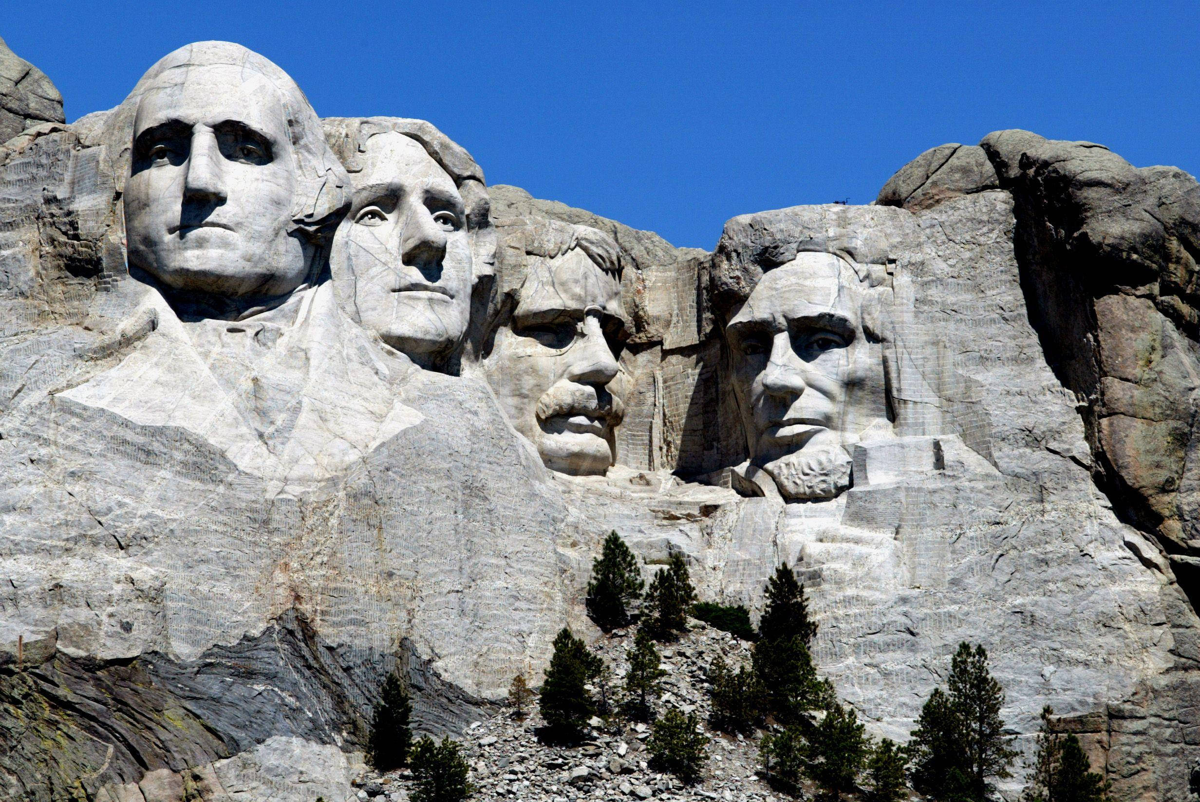 Son wat op Mount Rushmore skyn Muurpapier