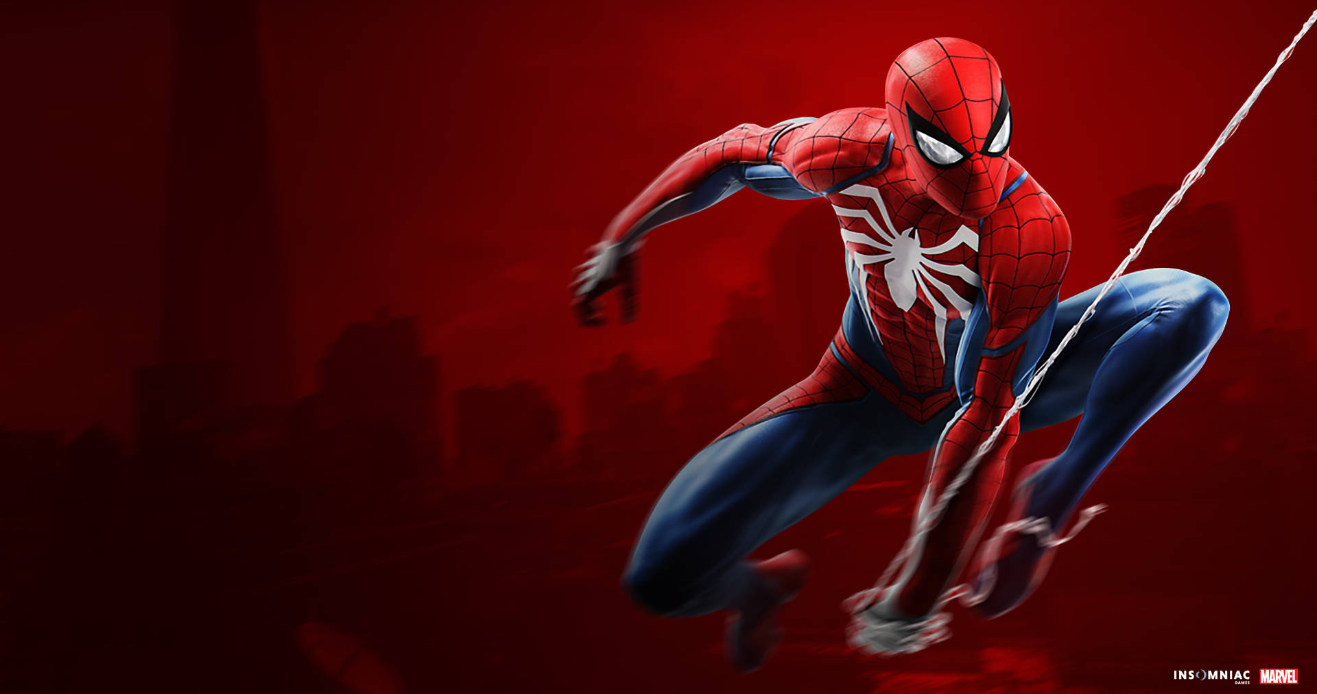 Spiderman in sy spinnerak op 'n rooi agtergrond.