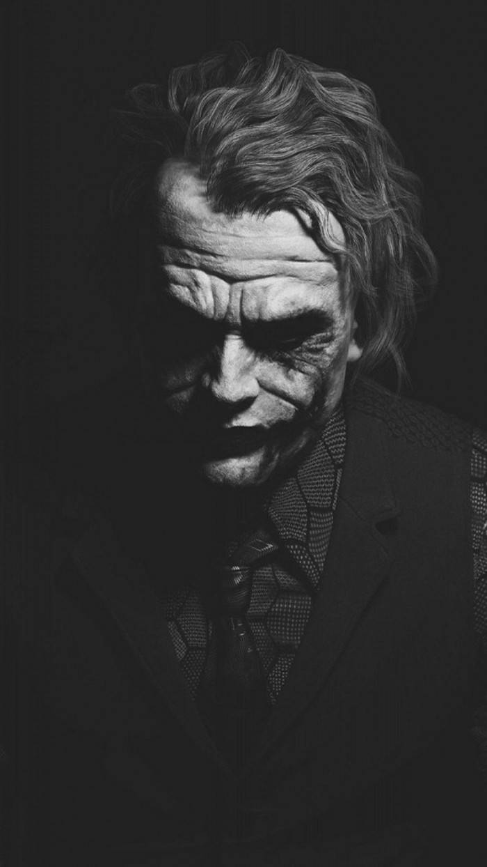 Swart en Wit Hartseer Joker Muurpapier