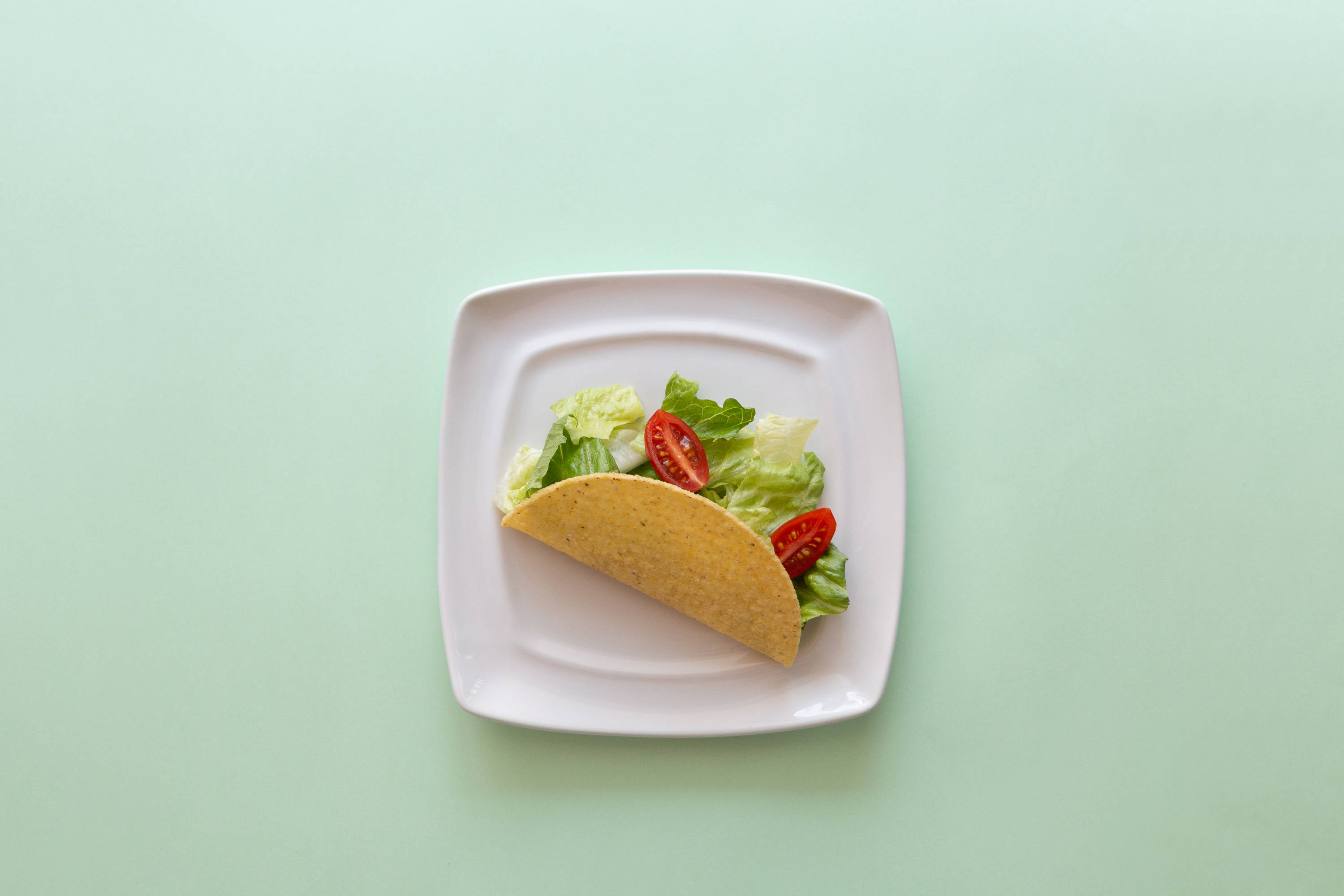Taco Op Pastelgroen Tafel Muurpapier