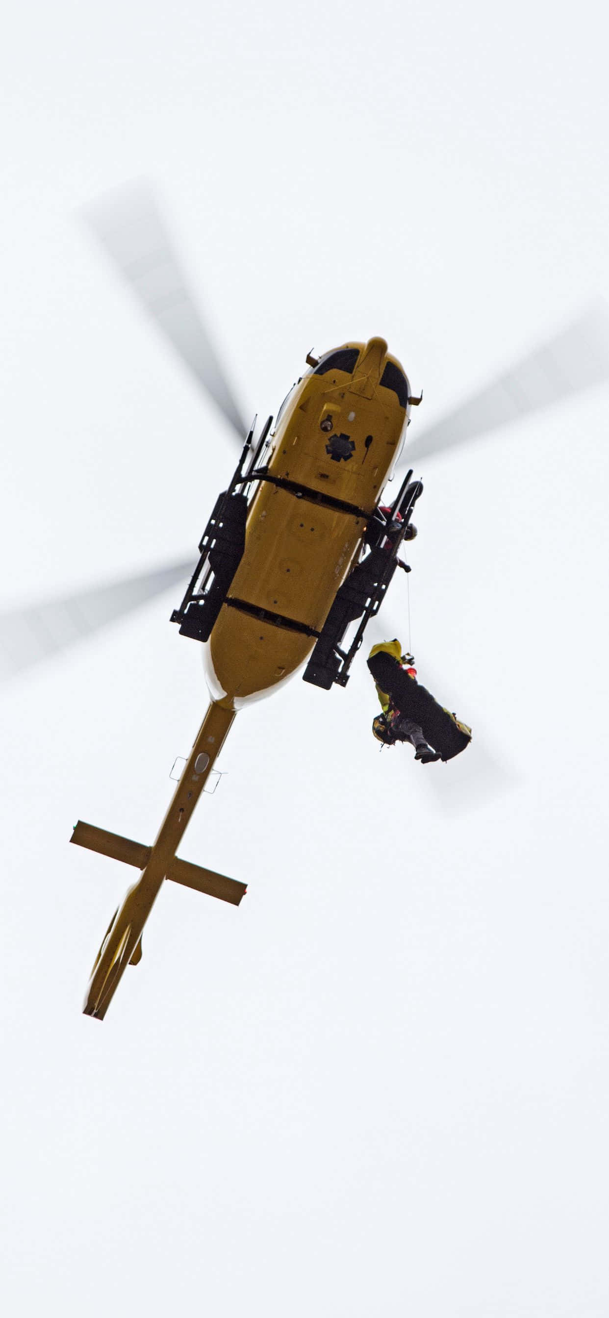 Vas die Skoonheid van die Lug in Styl met die iPhone Xs Max Helikopters Muurpapier