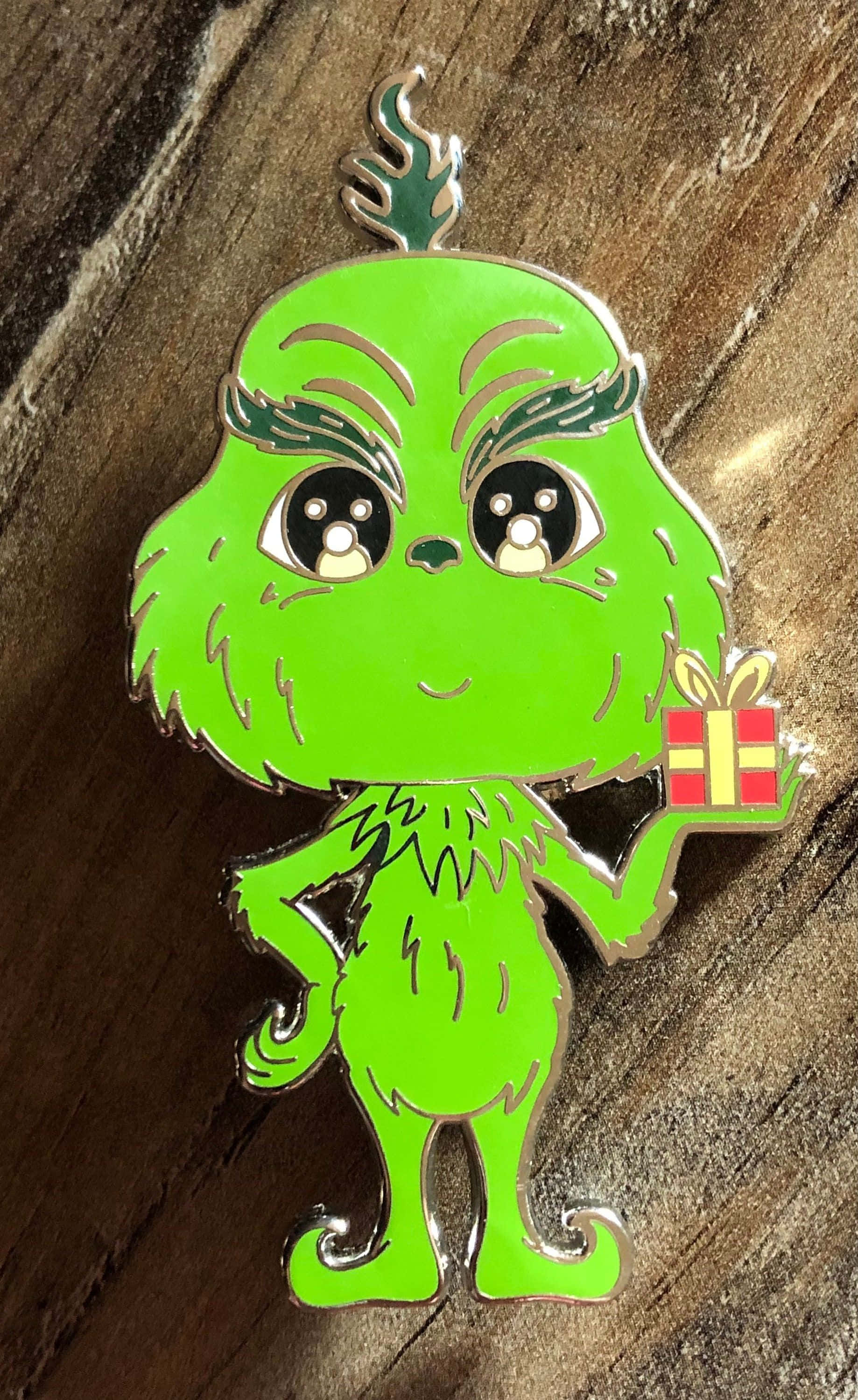 Versprei die Kersgees met hierdie oulike Grinch! Muurpapier