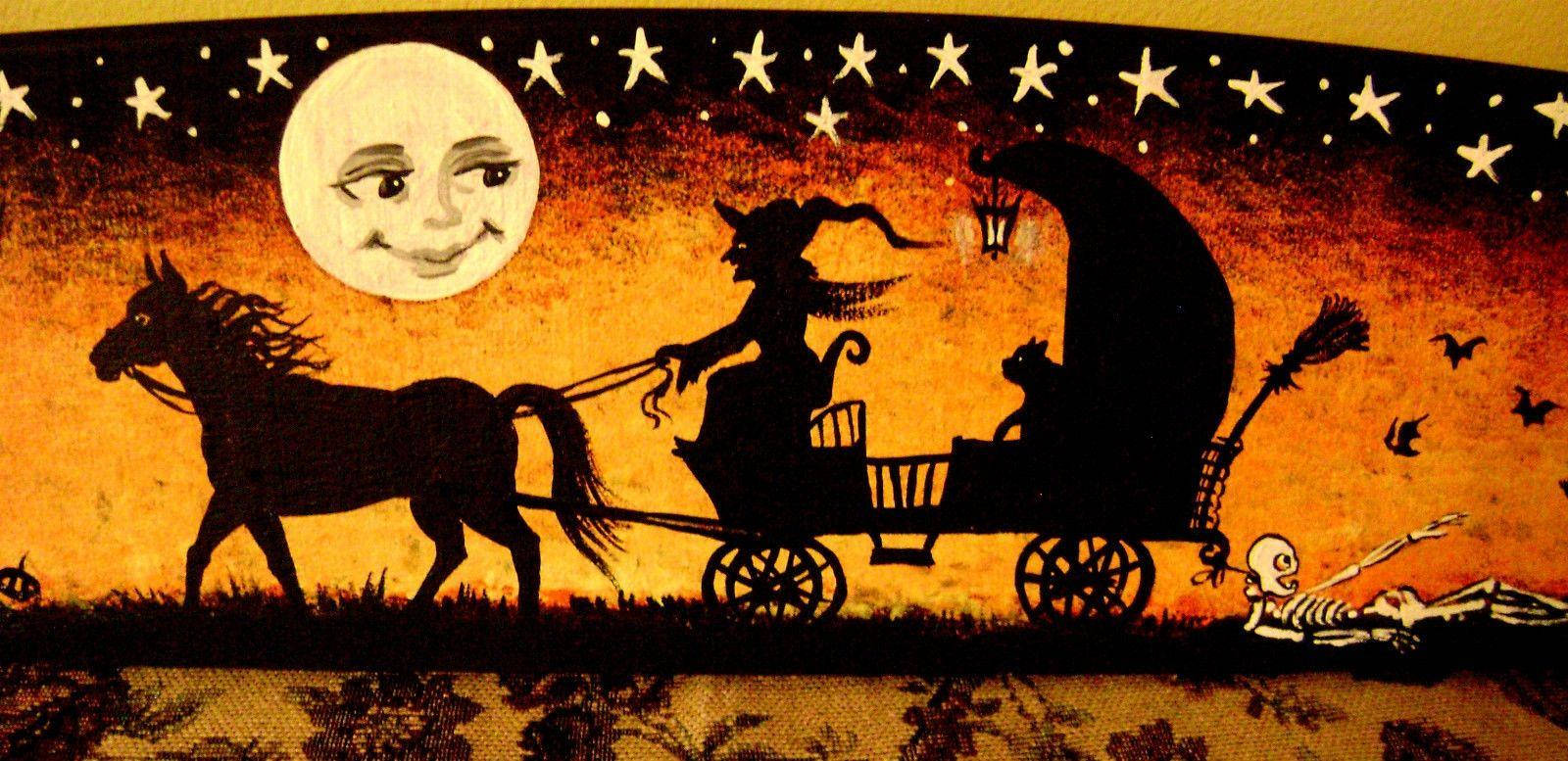 Vintage Heks in Koets vir Halloween Muurpapier