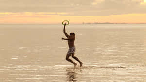 1440p Frisbee Agtergrond — Strand sonsondergang Muurpapier
